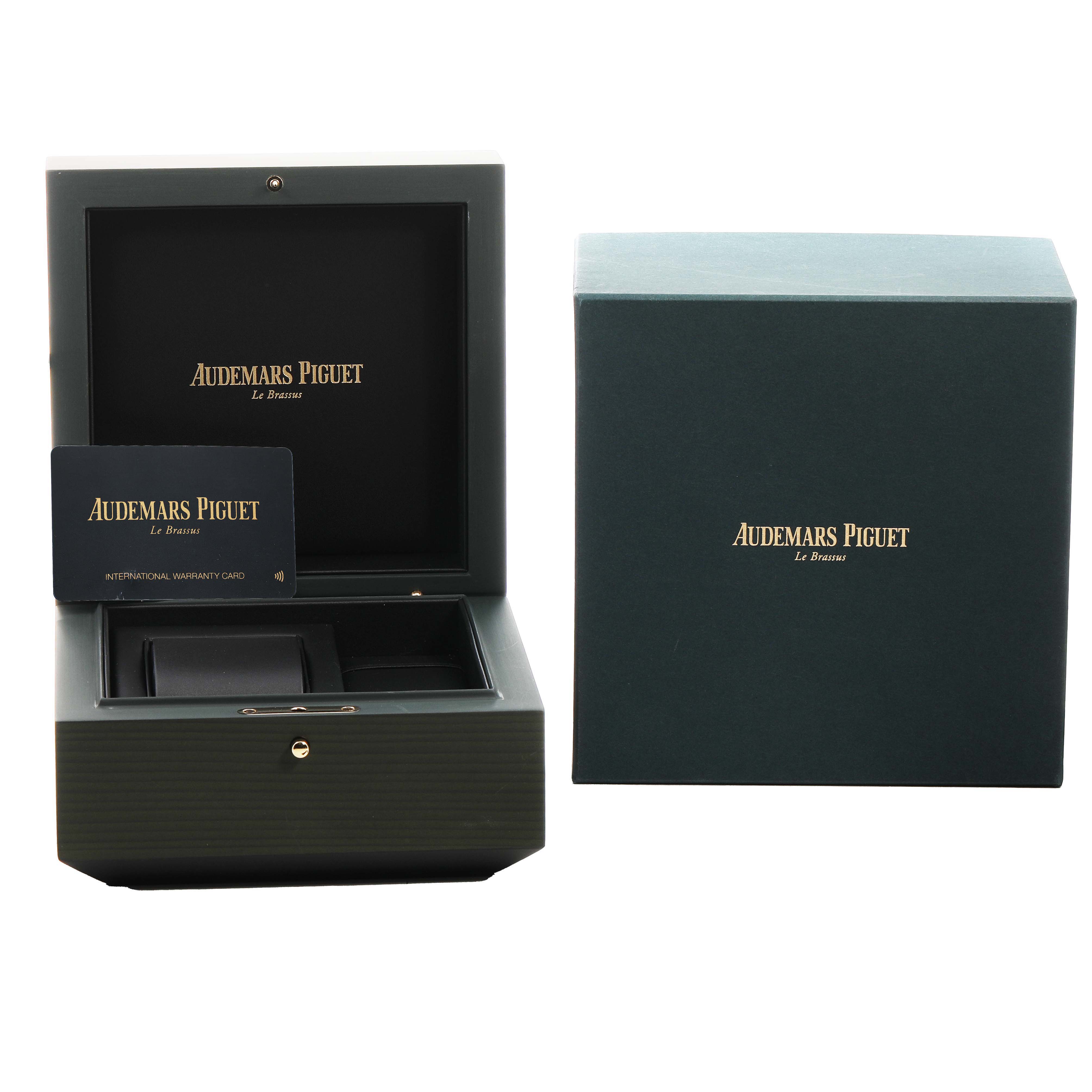 The image shows the open presentation box and warranty card for an Audemars Piguet Royal Oak Offshore 15720ST.OO.A052CA.01 Men's Stainless Steel Green Dial, with the outer box beside them.