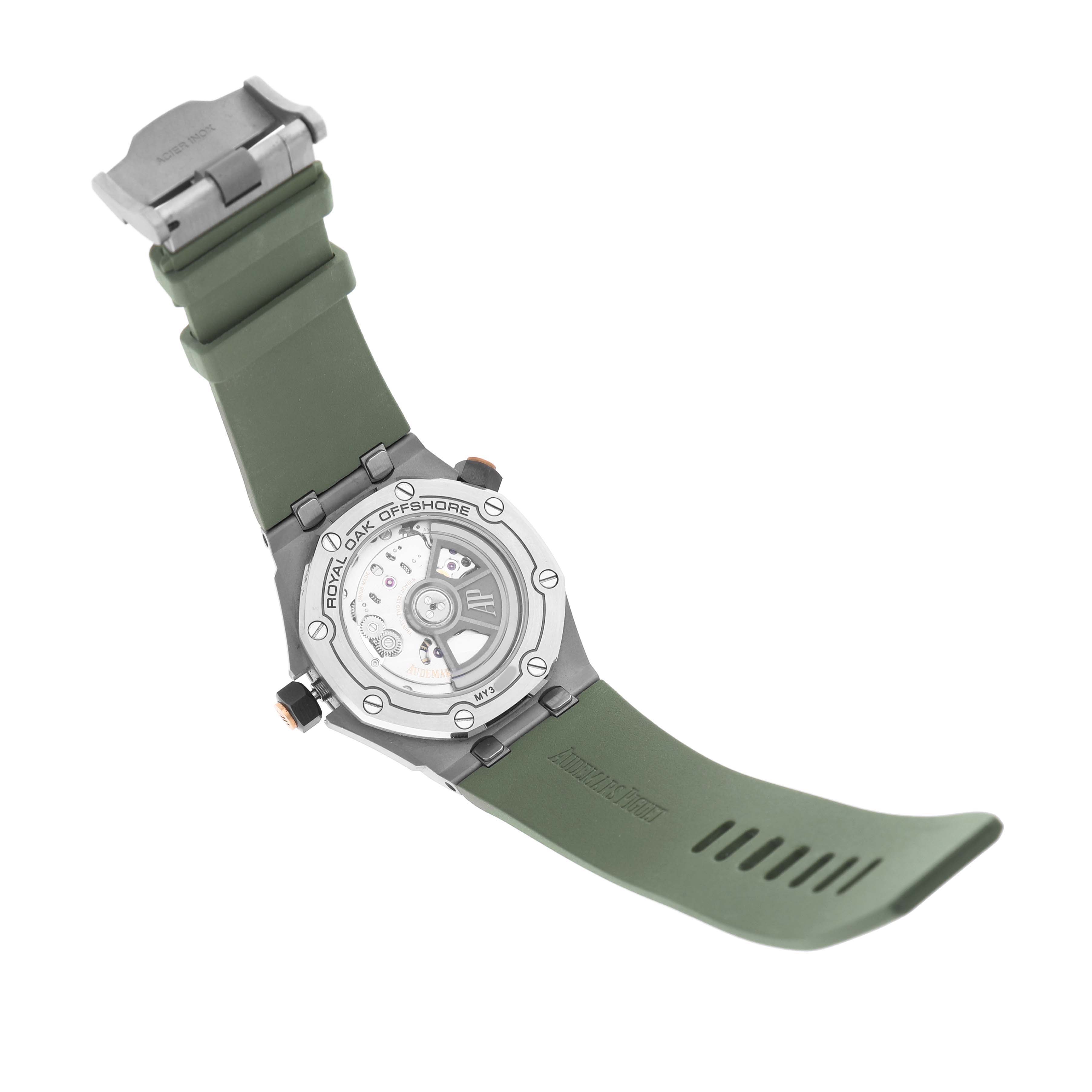 The Audemars Piguet Royal Oak Offshore 15720ST.OO.A052CA.01 Men's Stainless Steel Green Dial watch is shown from the back, highlighting its open case back and rubber strap.