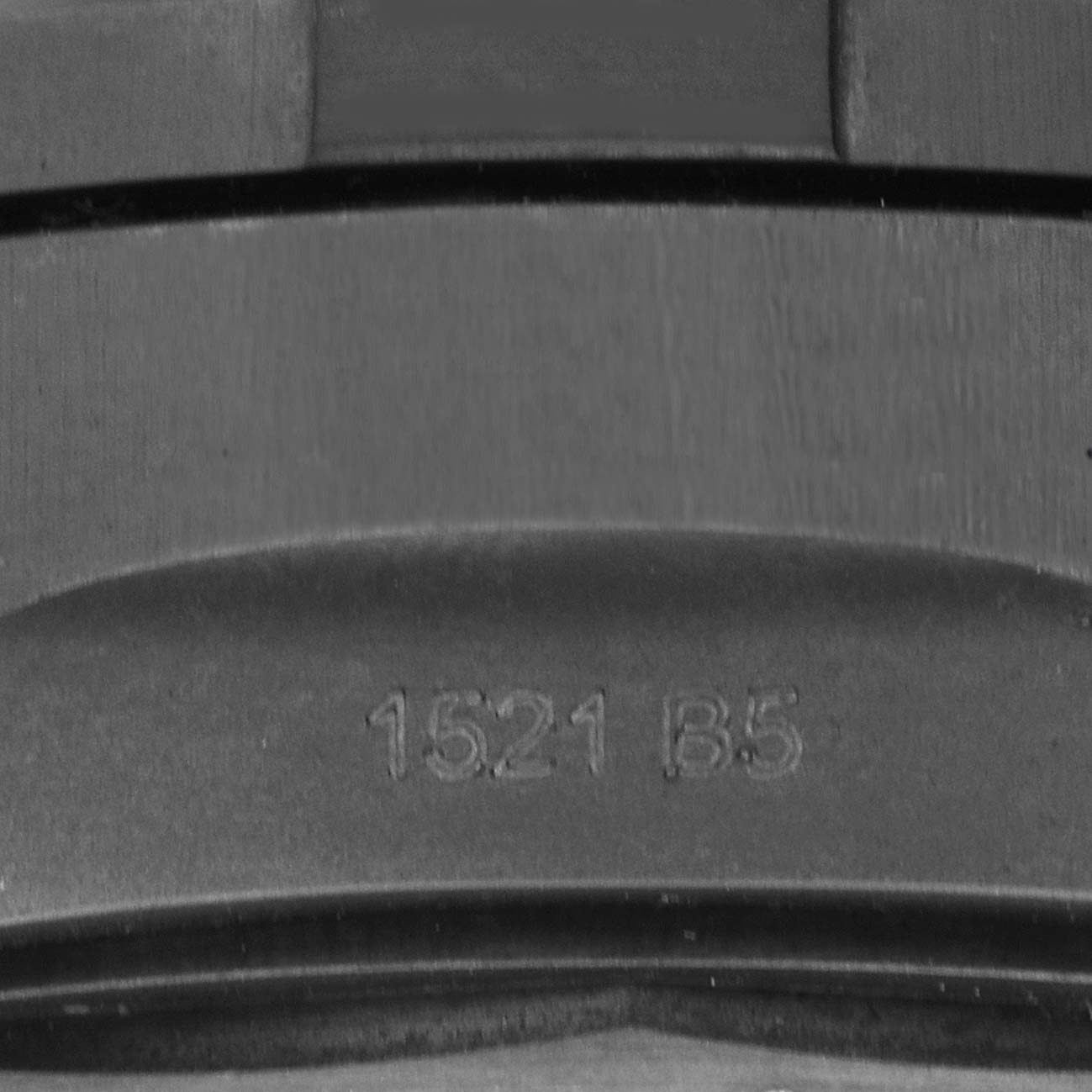 The image shows a close-up of the strap with a serial number for a Breitling Avenger V13317 Men
s Titanium Green Dial watch.