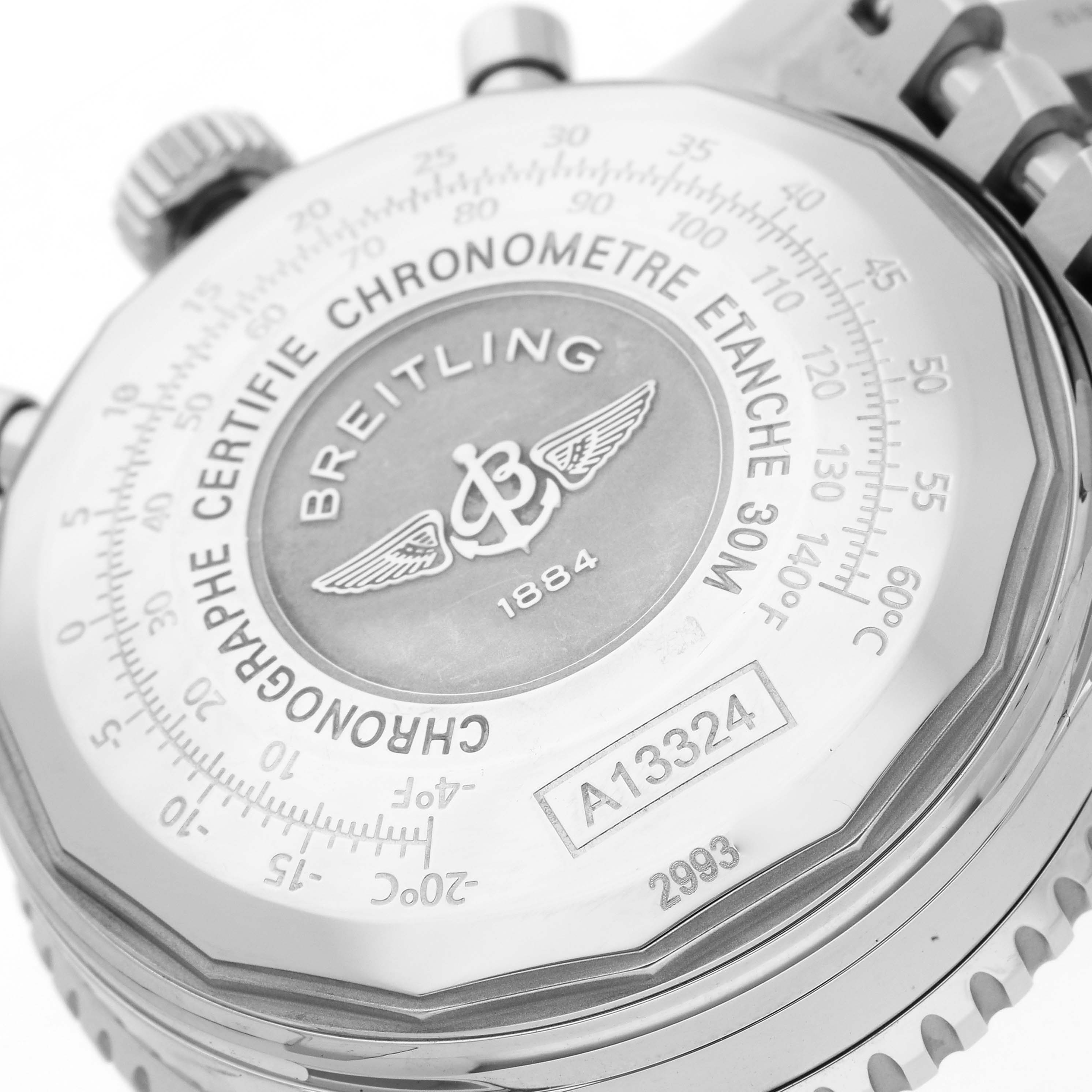 The image shows the back case of a Breitling Navitimer A13324121C1A1 Men's Stainless Steel Blue Dial A13324121C1A1 Men's Stainless Steel Blue Dial watch from a close-up angle, highlighting the engravings and serial number.