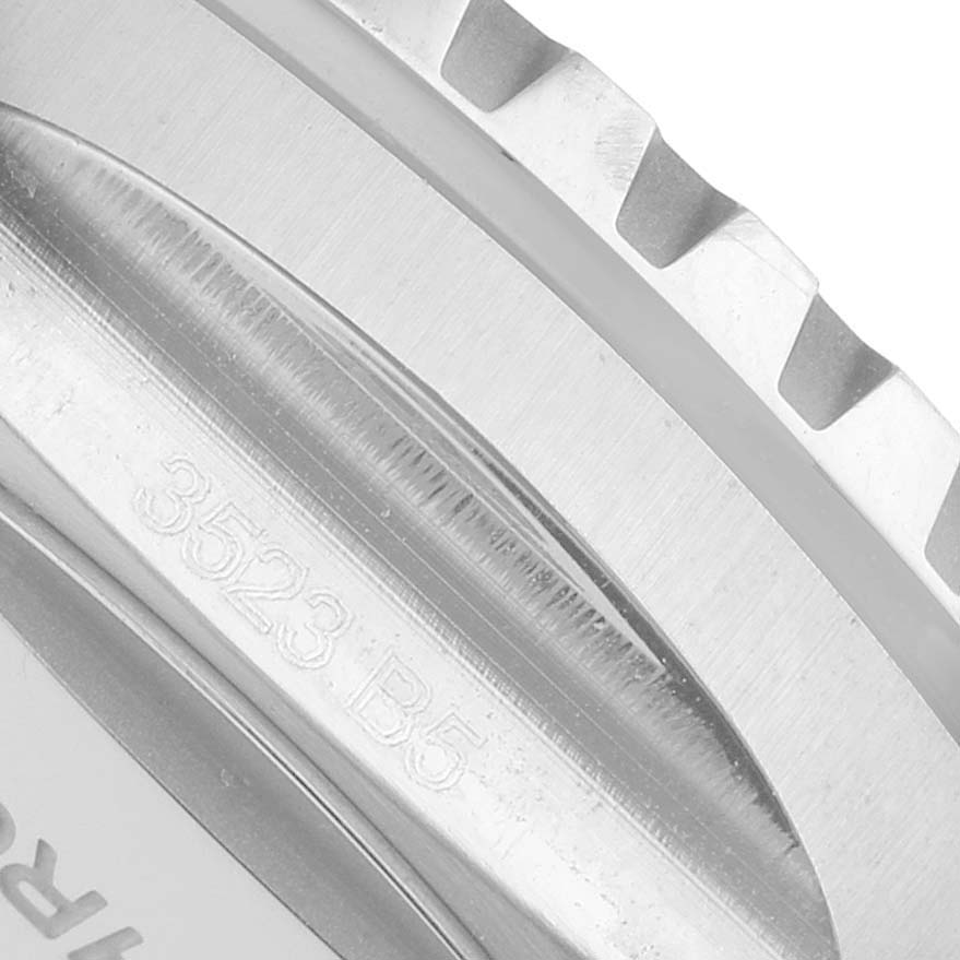 The image shows a close-up of the side of the bezel and engraved serial number on a Breitling Superocean A17375 Men's Stainless Steel Blue Dial watch.