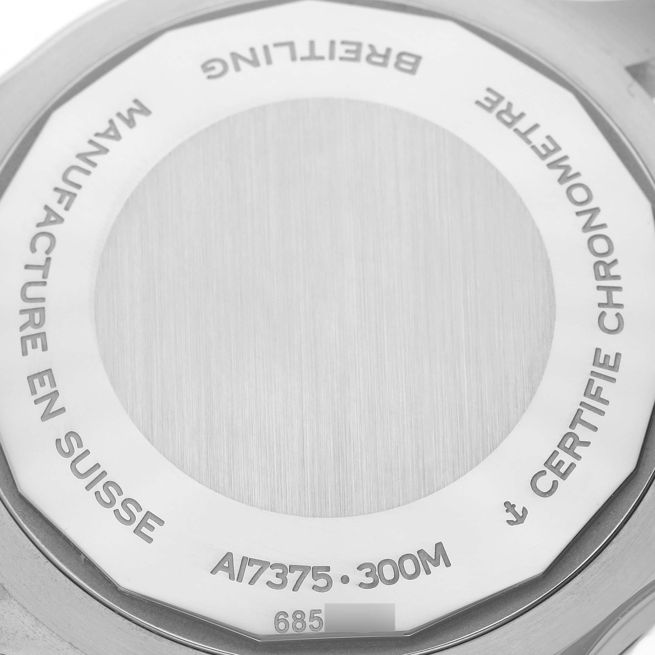 The image shows the case back of a Breitling Superocean A17375 Men's Stainless Steel Blue Dial watch, displaying model and certification details.
