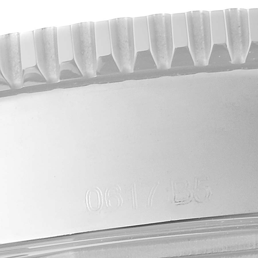 The image shows a close-up of the bezel and the engraved side of a Breitling Superocean A17365 Men's Stainless Steel Blue Dial A17365 Men's Stainless Steel Blue Dial watch.