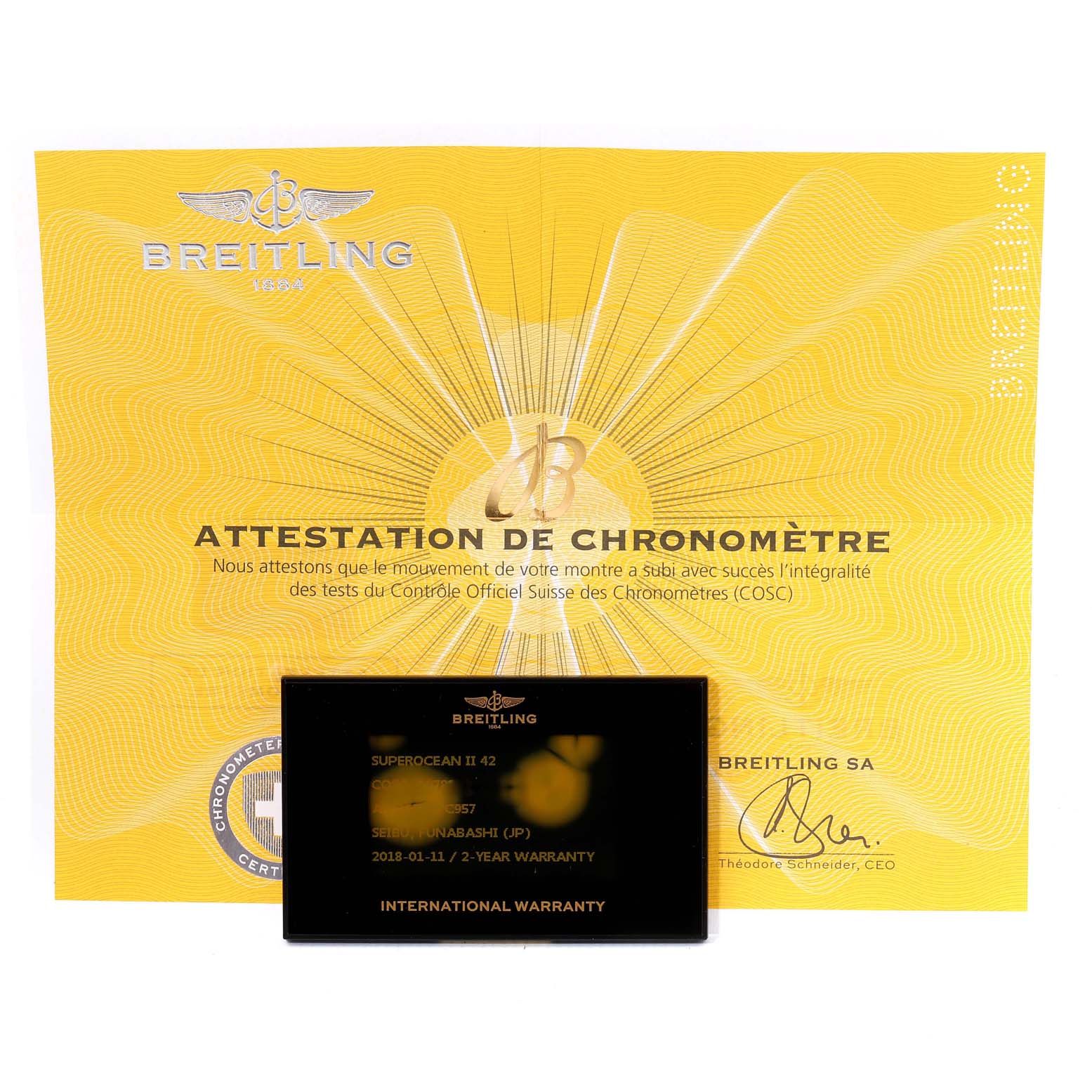 The image shows an international warranty card and a chronometer certificate for the Breitling Superocean A17365 Men's Stainless Steel Blue Dial A17365 Men's Stainless Steel Blue Dial II 42 watch.