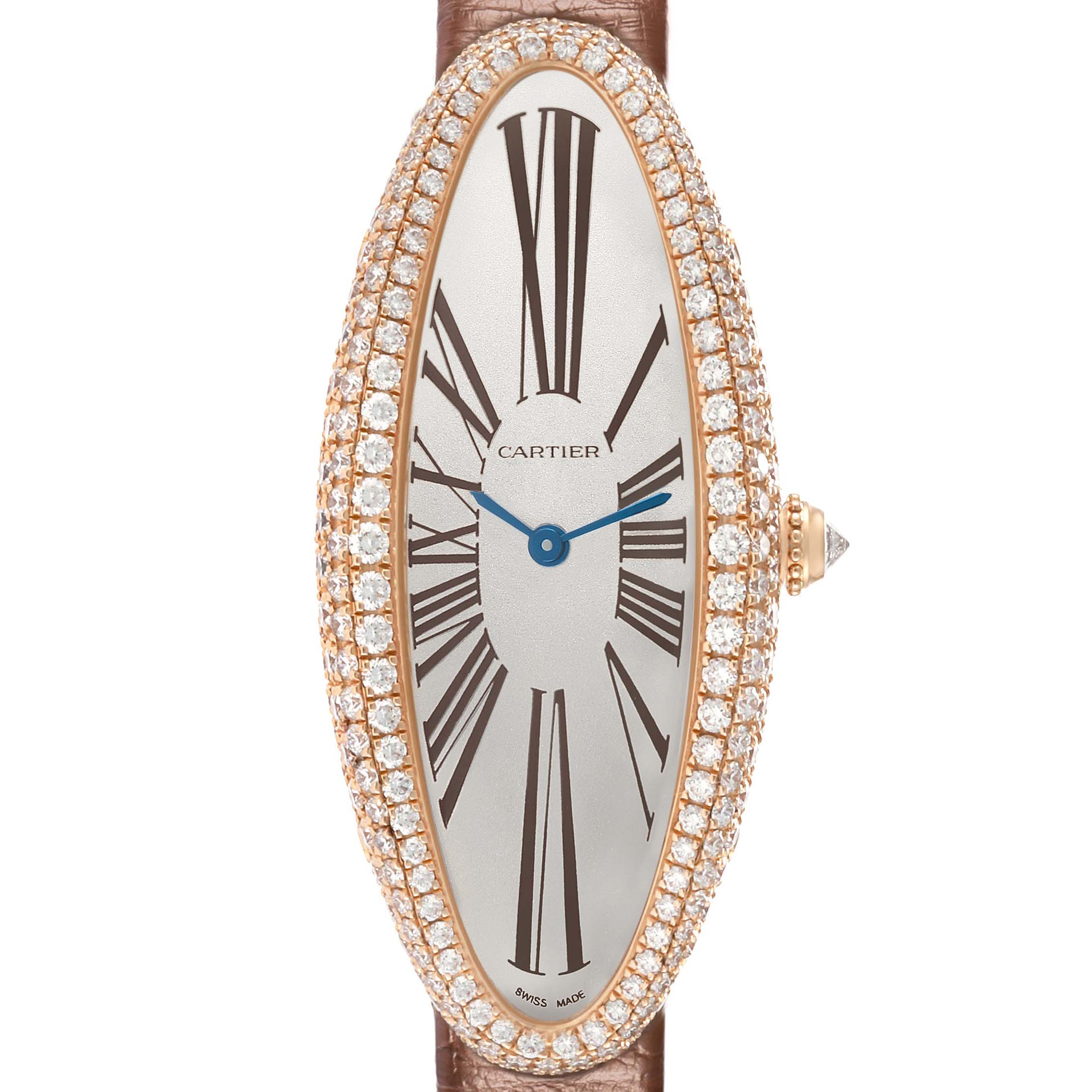 The Cartier Baignoire WJBA0006 Women's Rose Gold Silver Dial watch is shown in a frontal view, highlighting its elongated, oval face with a diamond bezel and leather strap.