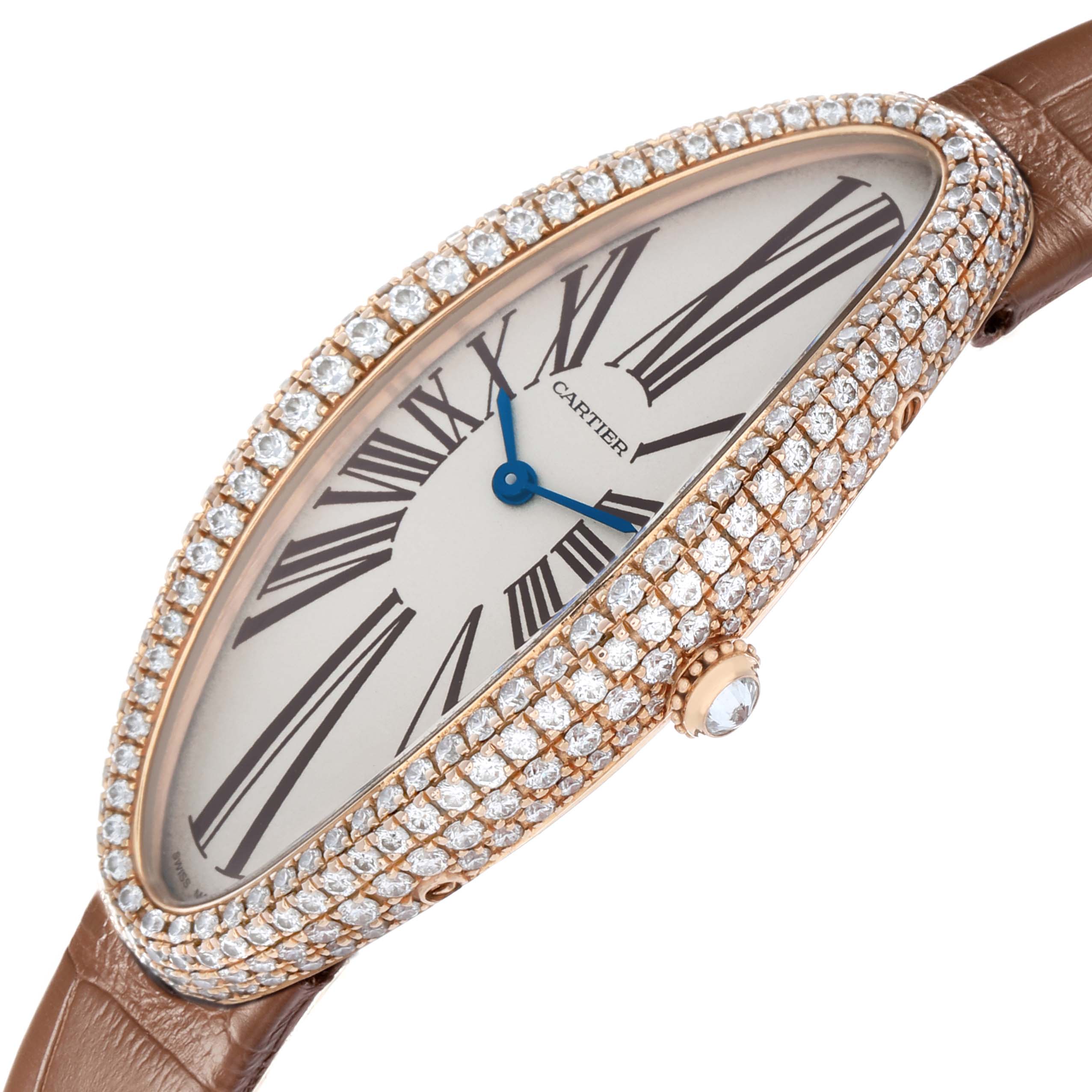 The Cartier Baignoire WJBA0006 Women's Rose Gold Silver Dial watch is shown at an angled view, highlighting its diamond-encrusted bezel, elongated face, and leather strap.