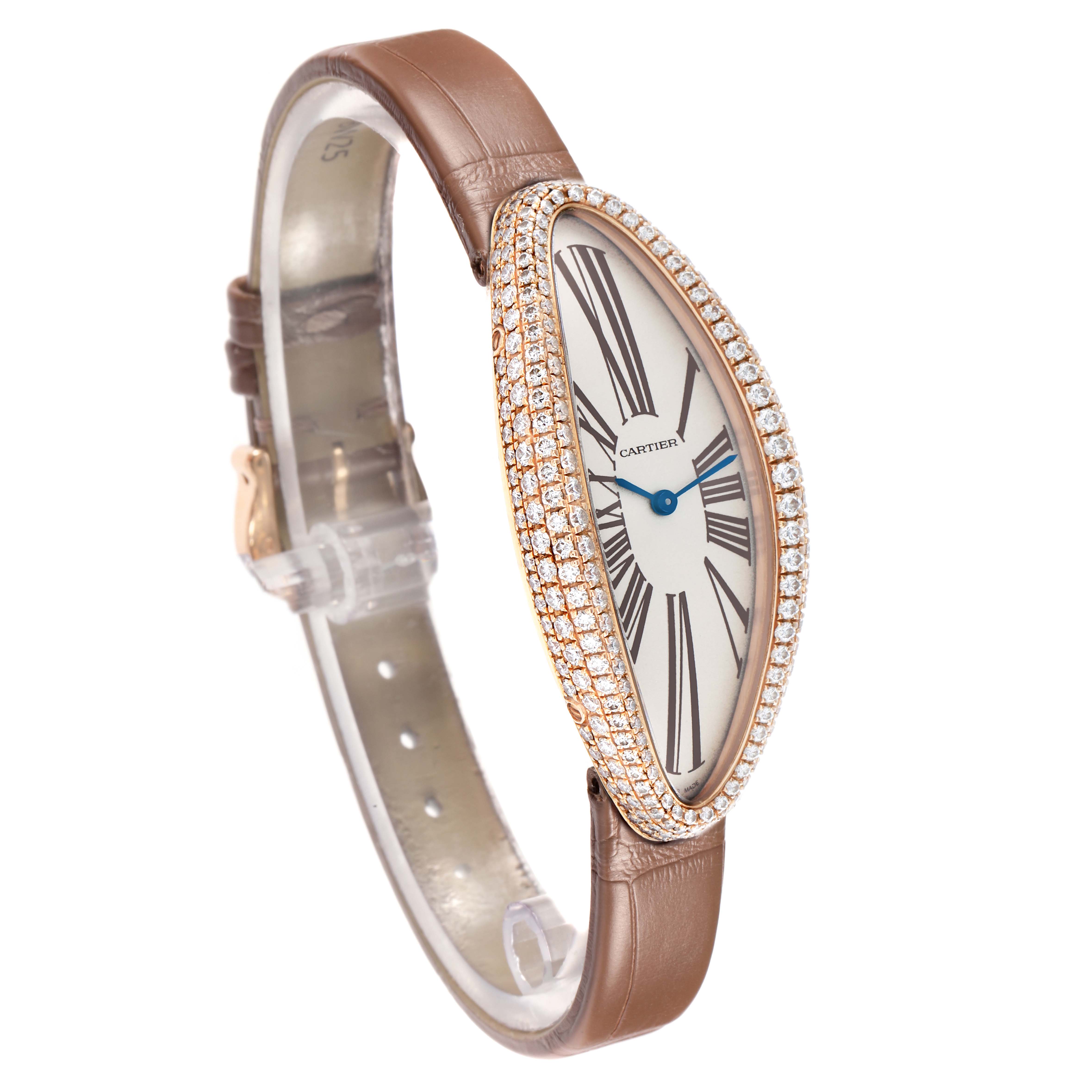 The Cartier Baignoire WJBA0006 Women's Rose Gold Silver Dial watch is shown at a slight angle, highlighting its oval face, diamond bezel, and brown leather strap.
