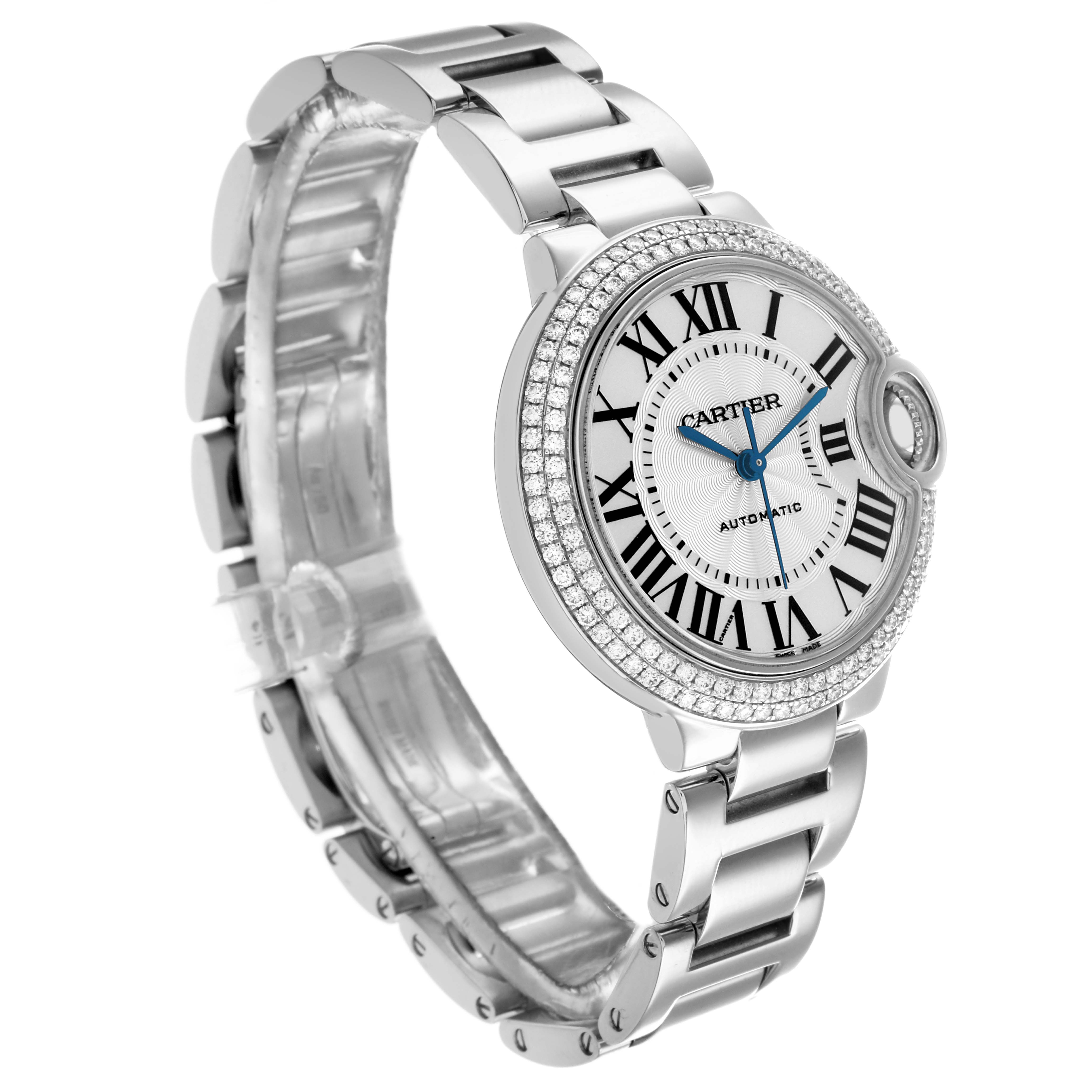 The Cartier Ballon Bleu WE902035 Women
s White Gold Silver Dial watch is shown at a three-quarter angle, highlighting the face, bracelet, and diamond bezel detail.