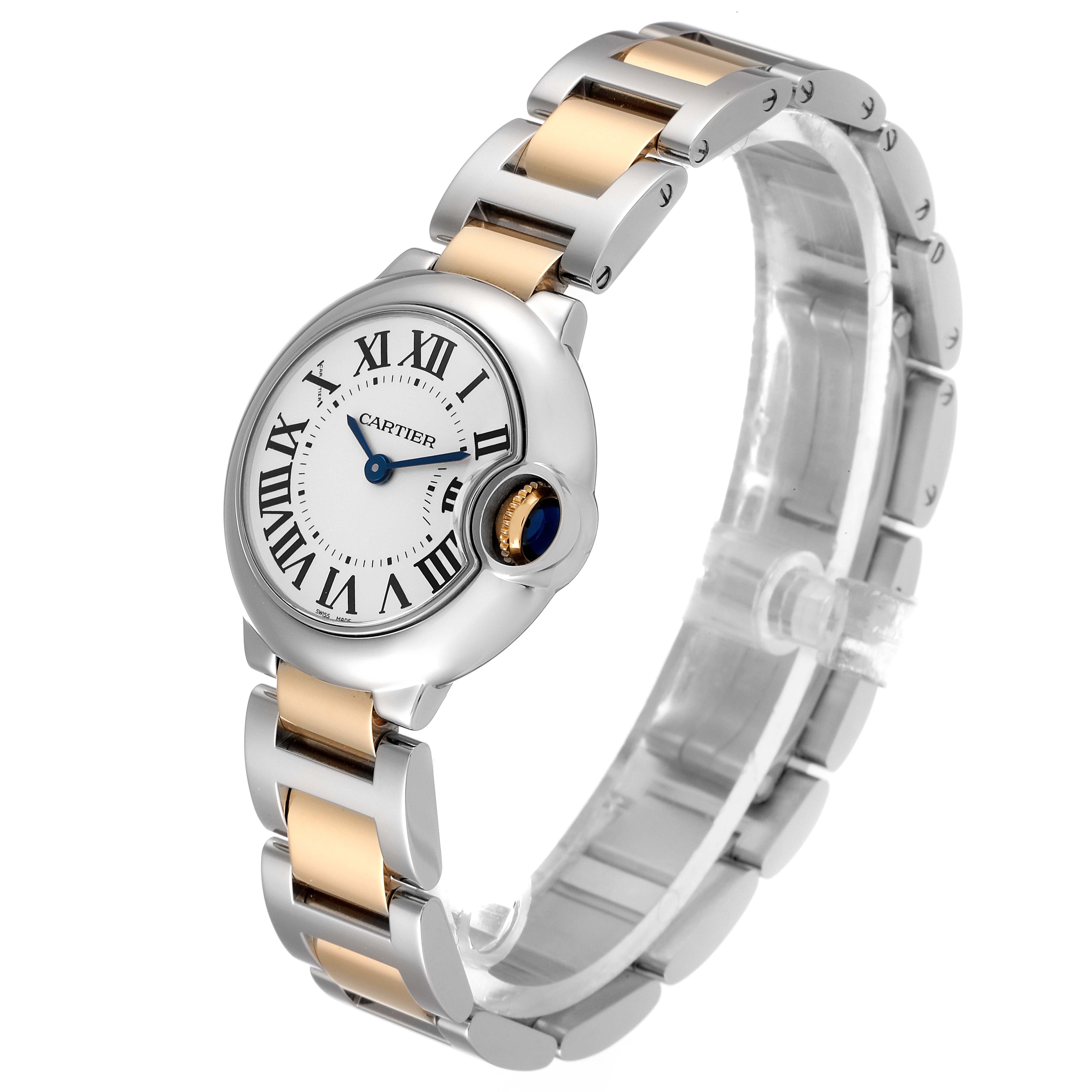 The image shows a Ballon Bleu de Cartier watch from a front angle, highlighting the face, crown, and metal bracelet.