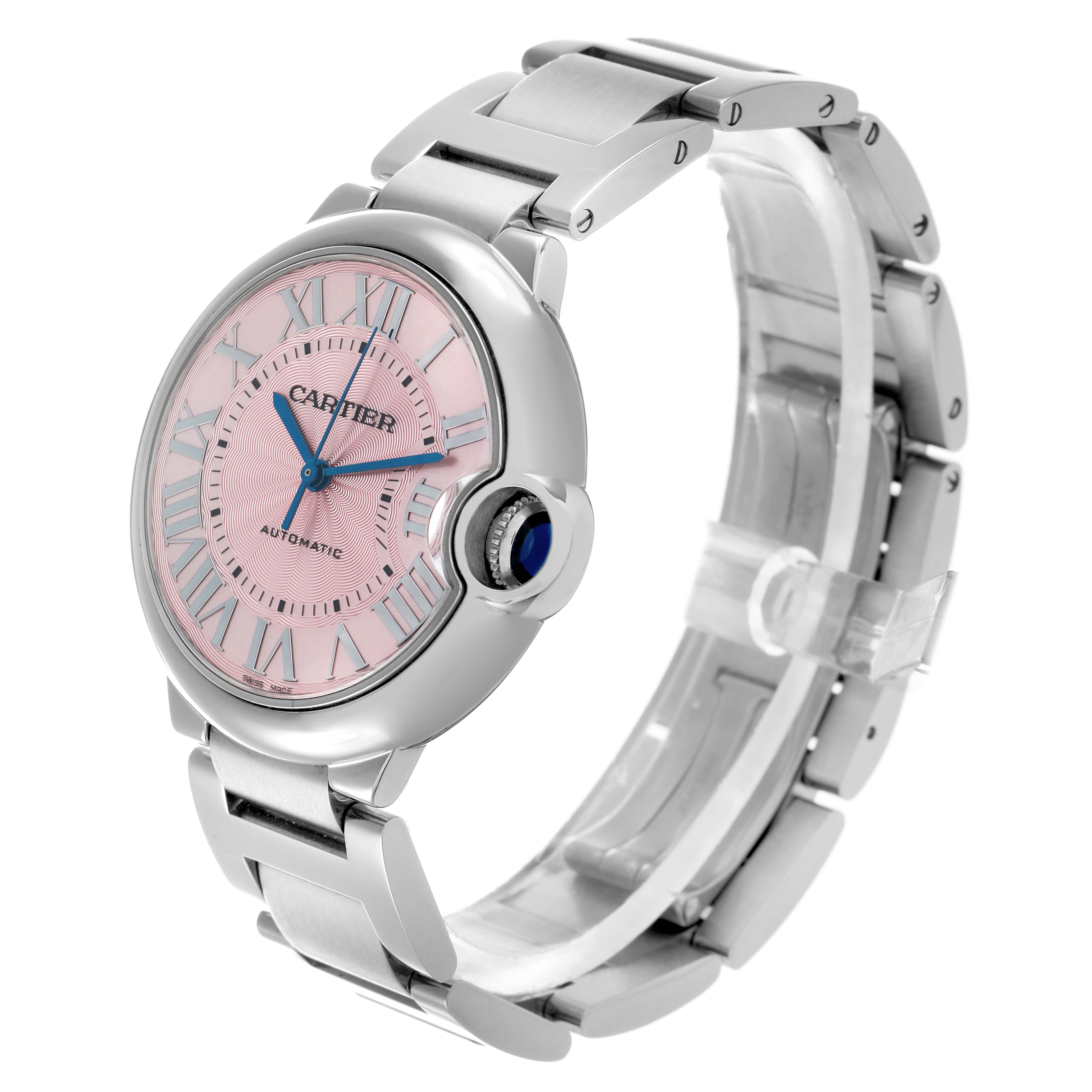 The Cartier Ballon Bleu W6920041 Women's Stainless Steel Pink Dial watch is shown at a three-quarter angle, highlighting the pink dial, blue hands, crown, and metal bracelet.