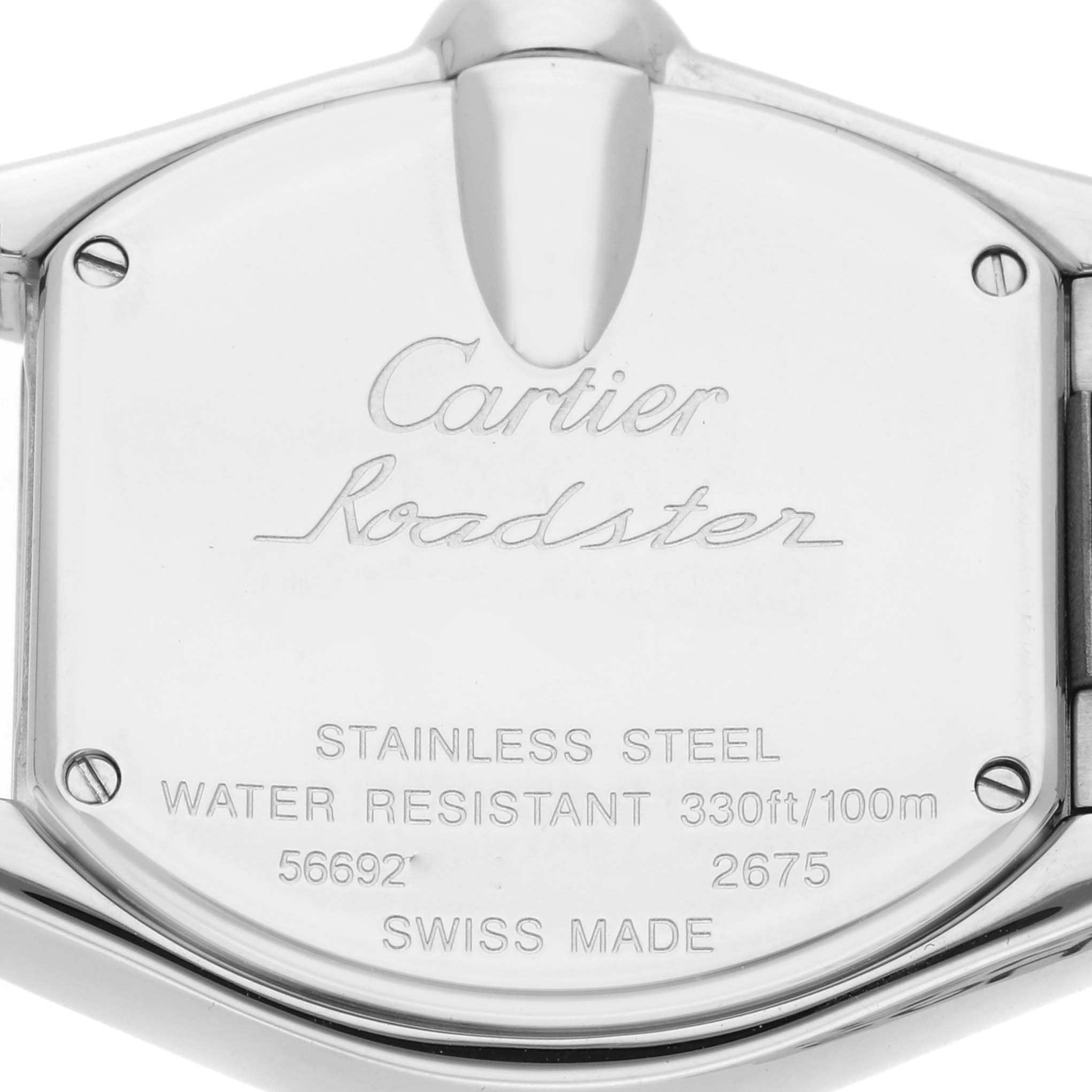 The image shows the back of a Cartier Roadster W62016V3 Women
s Stainless Steel Silver Dial watch, highlighting its stainless steel case and engraved details.