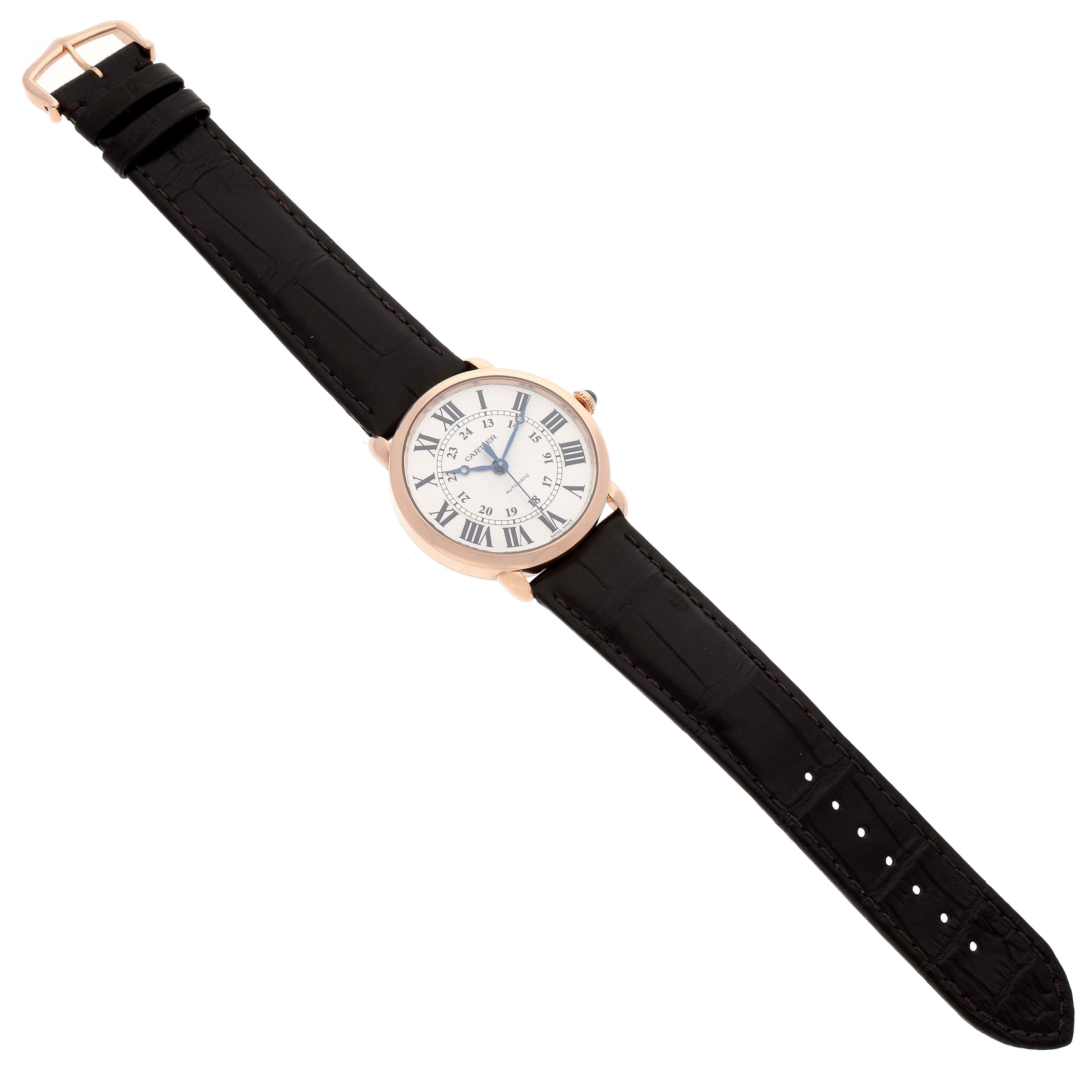 The image shows a top view of the Cartier Ronde WGRN0006 Men
s Rose Gold Silver Dial WGRN0006 Men
s Rose Gold Silver Dial model watch, displaying its black strap and white dial with Roman numerals.