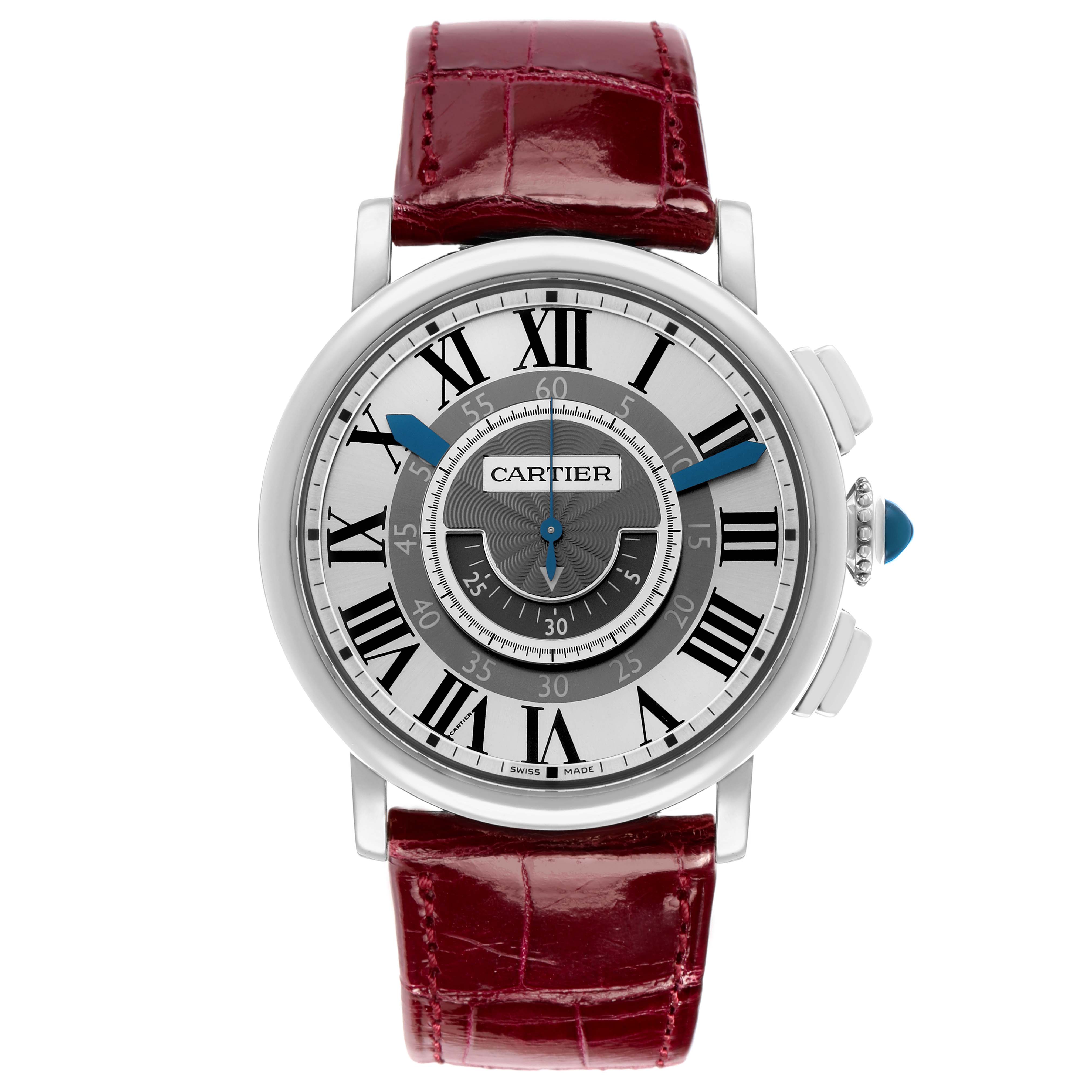 The Rotonde de Cartier watch is shown from the front, displaying the dial, hands, crown, and red leather strap.
