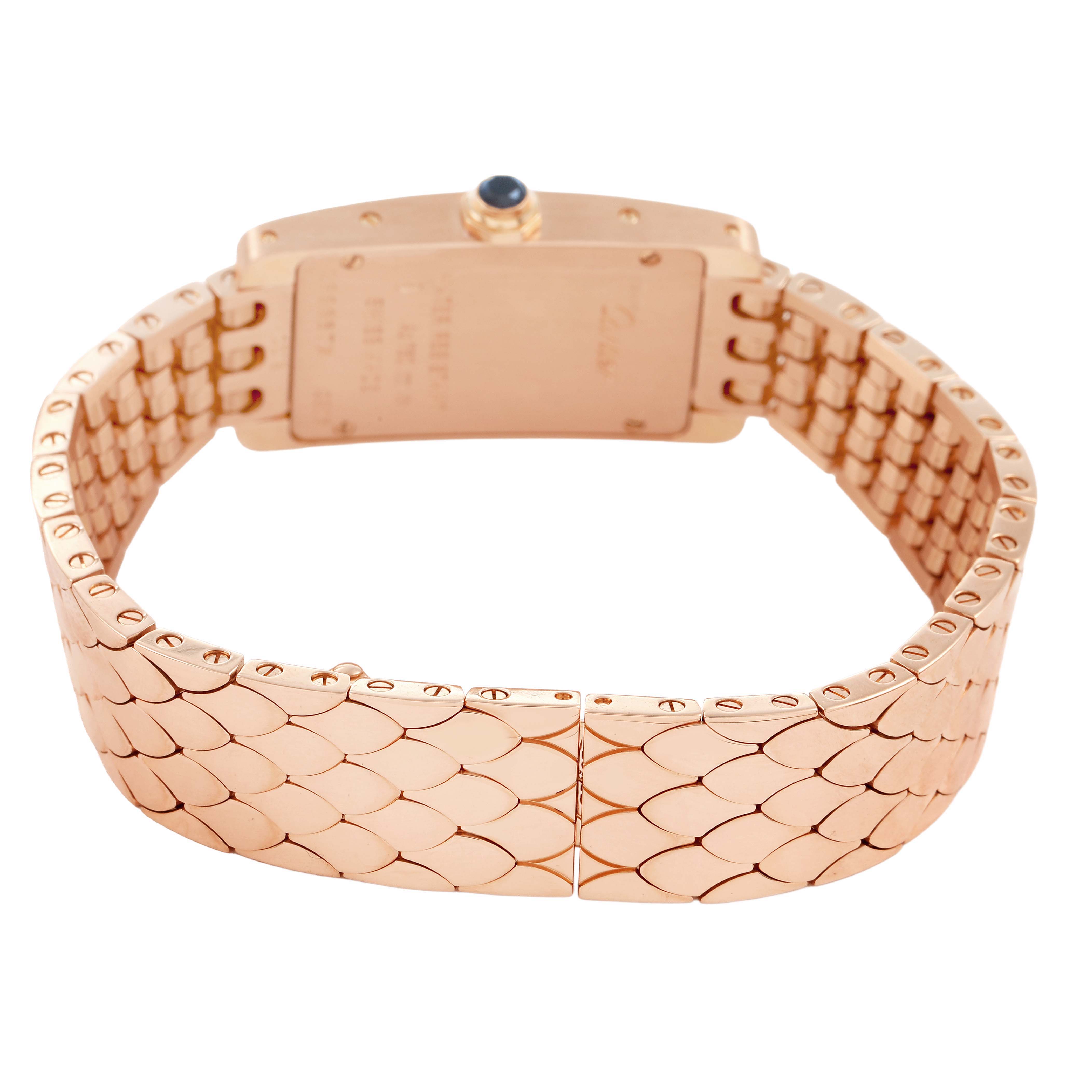 The image shows the back view of a Cartier Tank Américaine model, highlighting the gold bracelet and clasp.