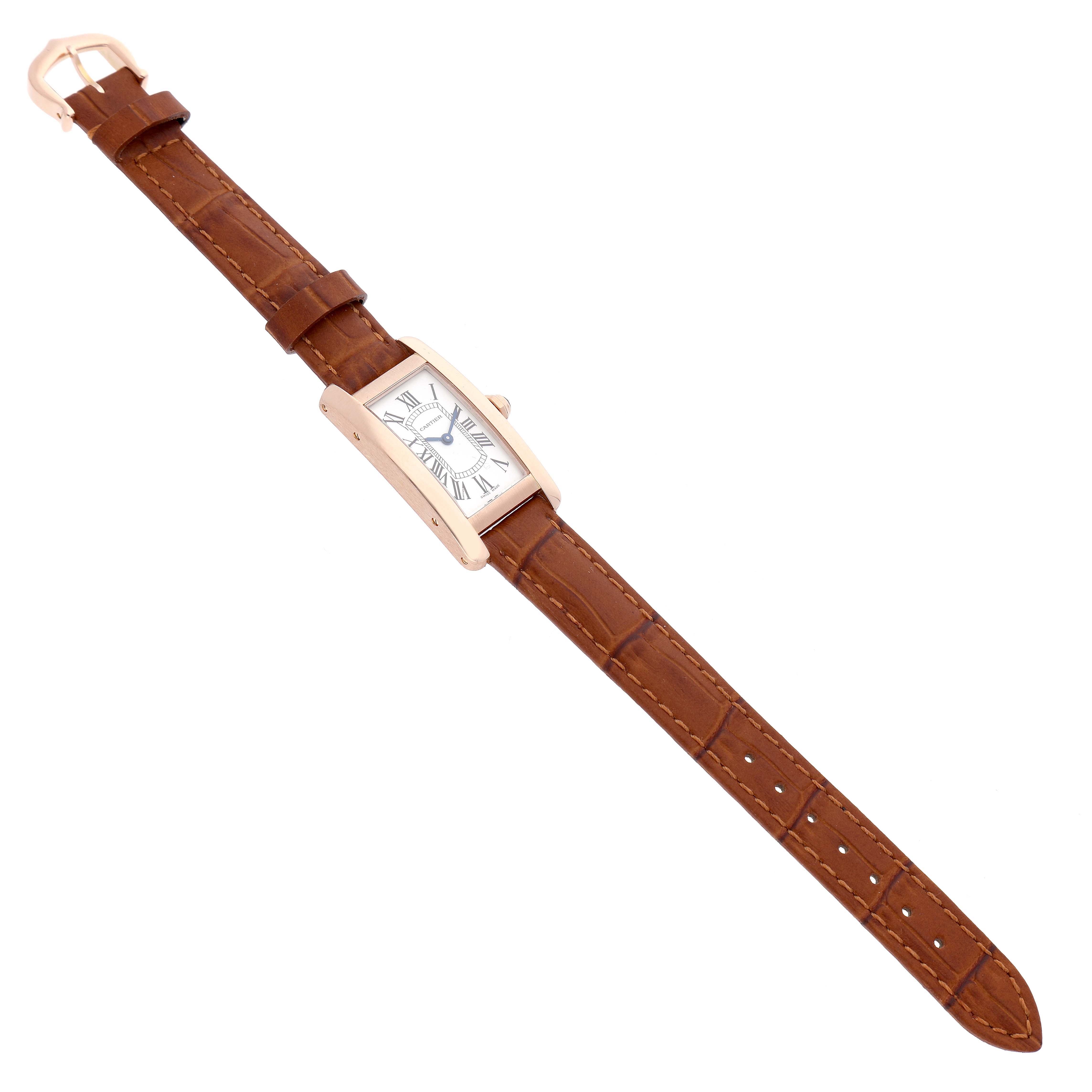 The image shows a Cartier Tank Americaine W2607456 Women's Rose Gold Silver Dial watch from a top-down angle, displaying the brown leather strap and rectangular dial.