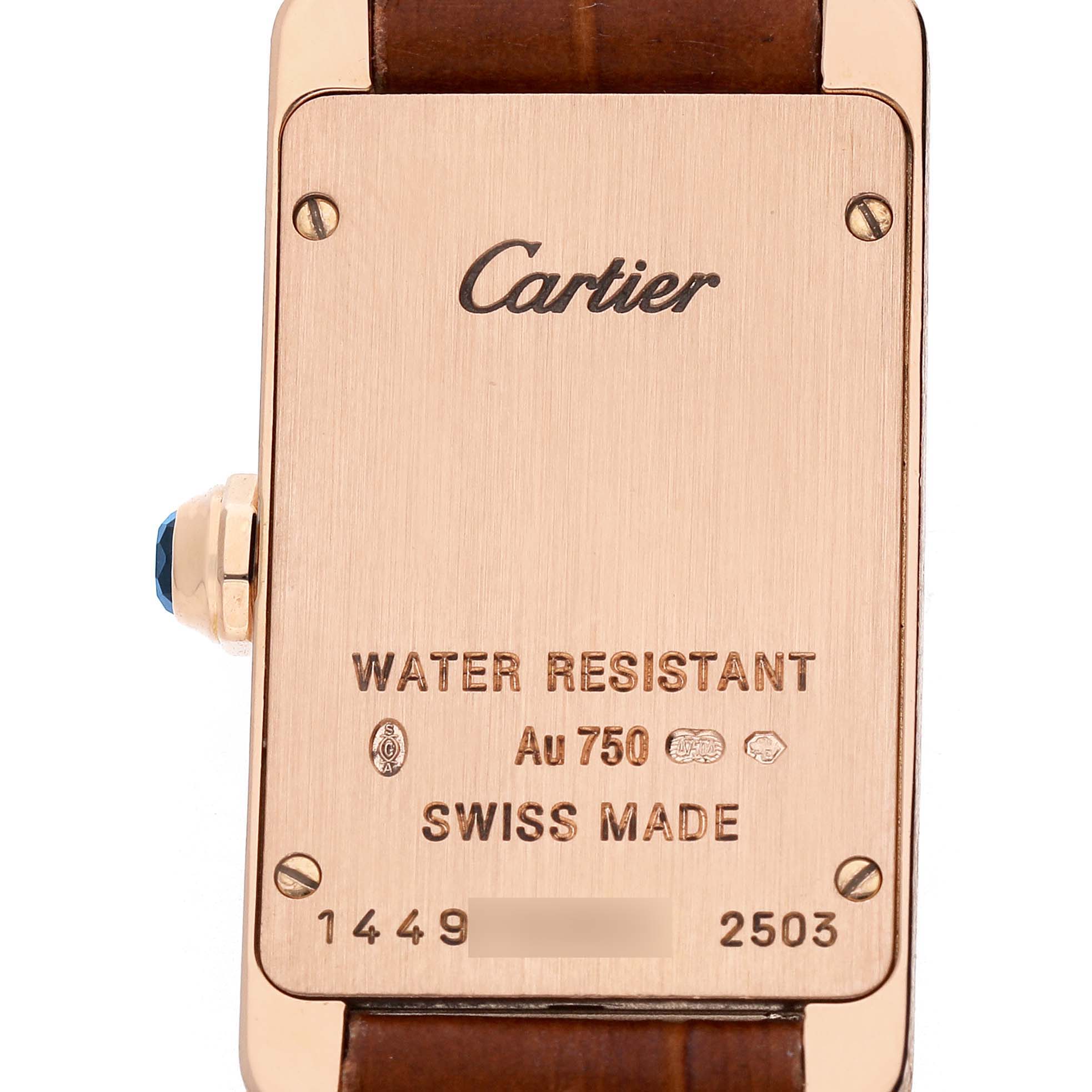 The image shows the back of the Cartier Tank Americaine W2607456 Women's Rose Gold Silver Dial watch, highlighting its engravings and crown detail.