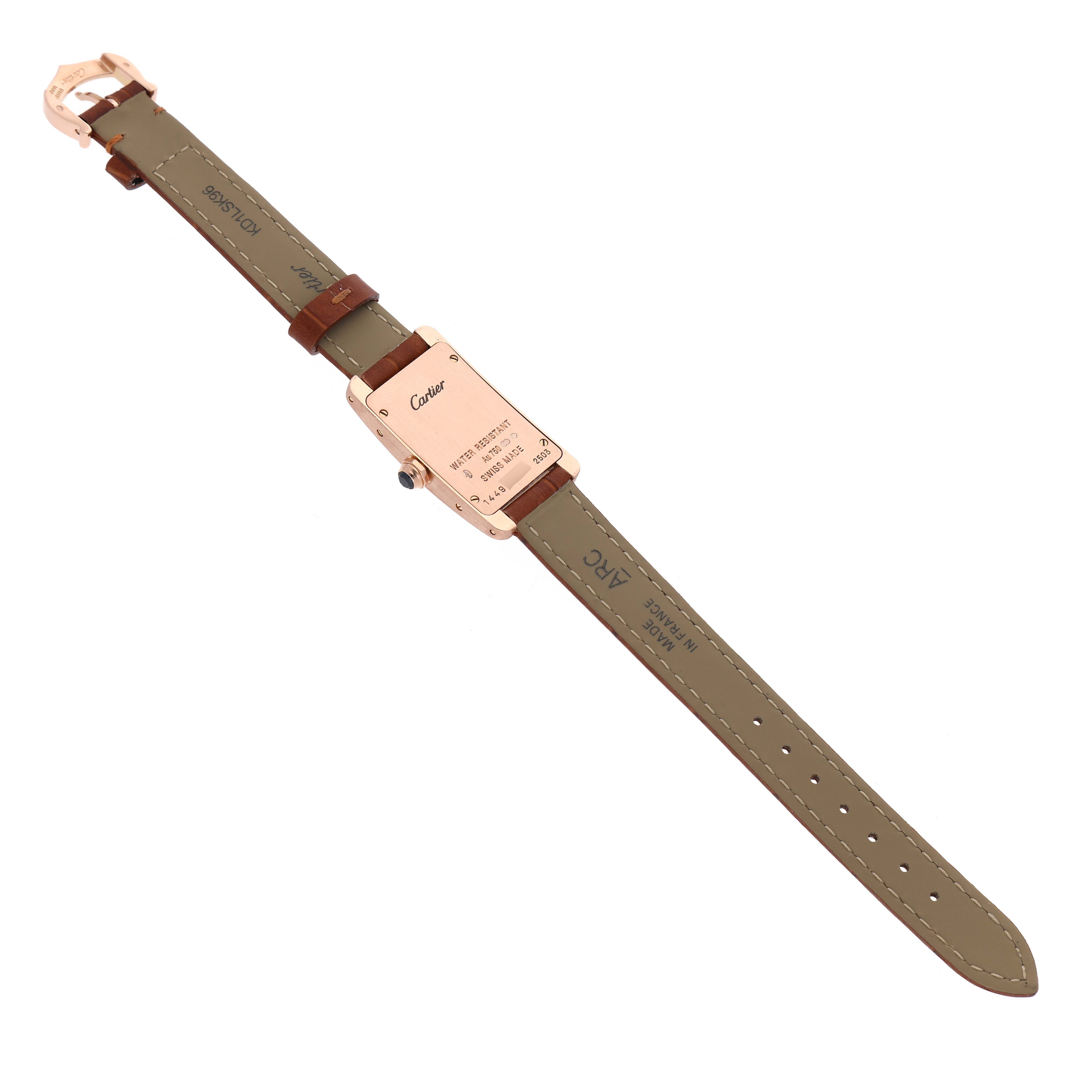 The Cartier Tank Americaine W2607456 Women's Rose Gold Silver Dial is shown from the back, highlighting the case back and the full leather strap.