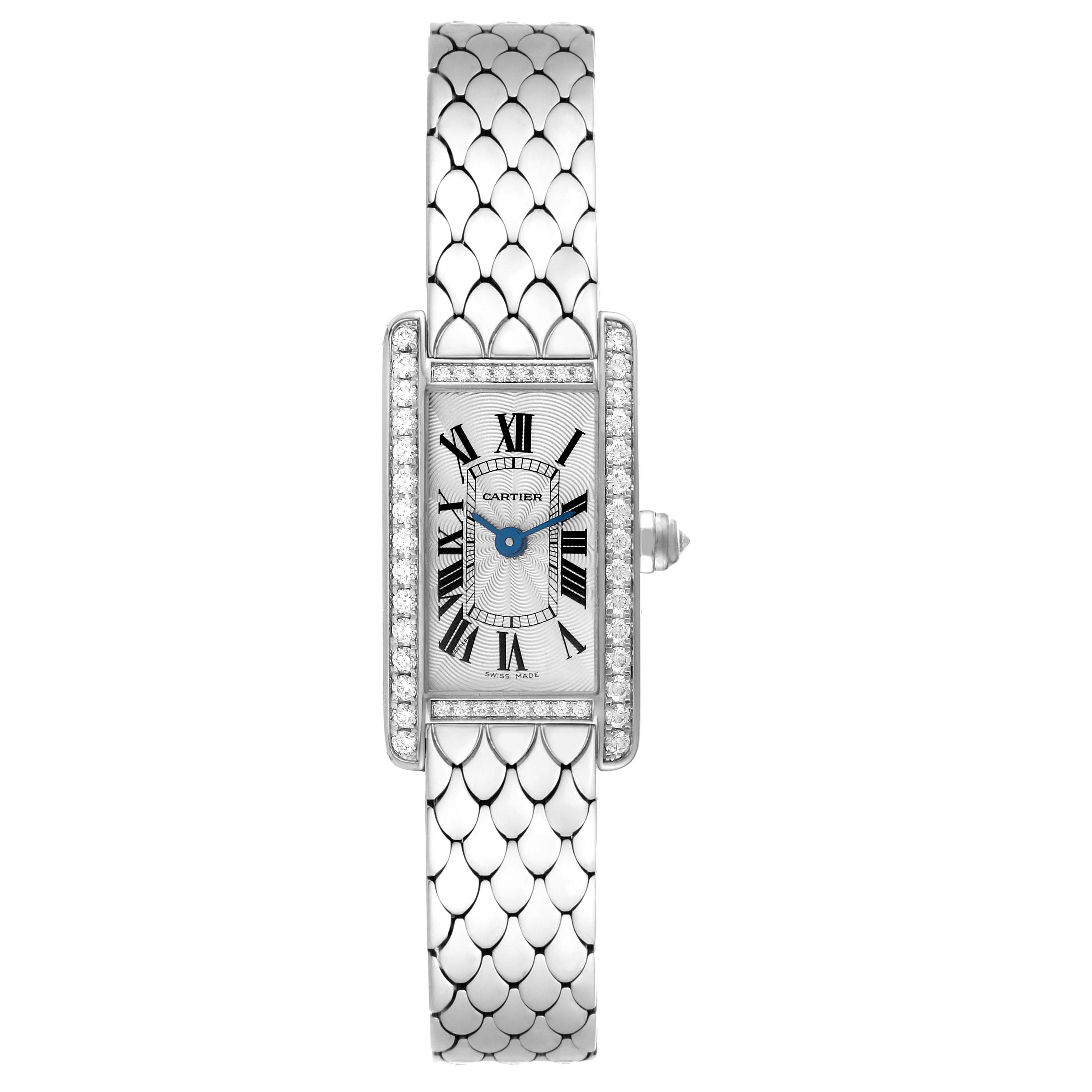 The image shows a top-down view of the Cartier Tank Americaine WB710013 Women's White Gold Silver Dial WB710013 Women's White Gold Silver Dial watch, highlighting its rectangular face, diamond bezel, and unique band.