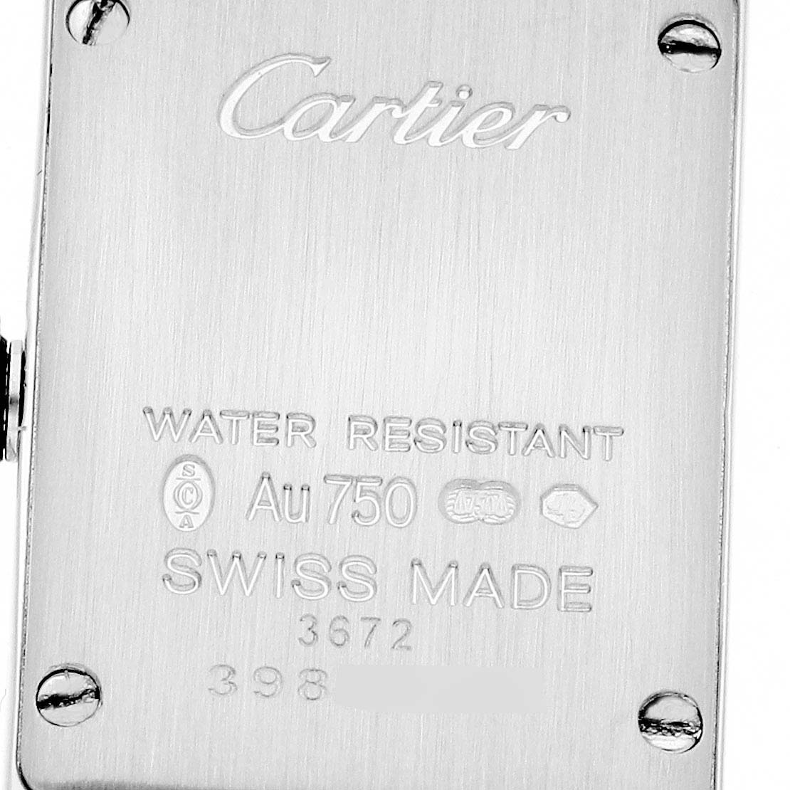 This image shows the back case of the Cartier Tank Americaine WB710013 Women's White Gold Silver Dial WB710013 Women's White Gold Silver Dial watch, highlighting engravings and screws.