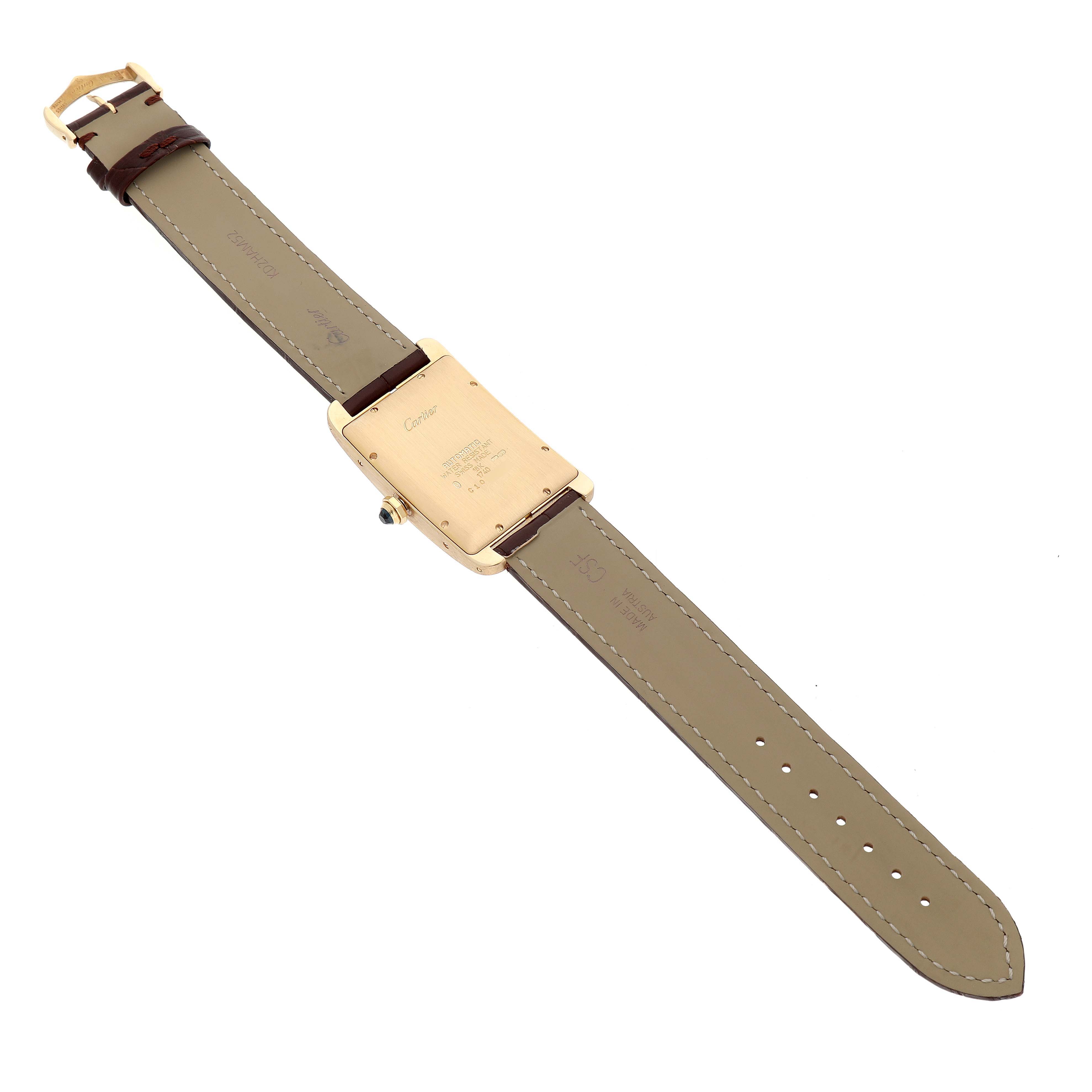 The image shows the back view of the Cartier Tank Americaine W2603156 Men's Yellow Gold Silver Dial watch, highlighting the case back and leather strap.
