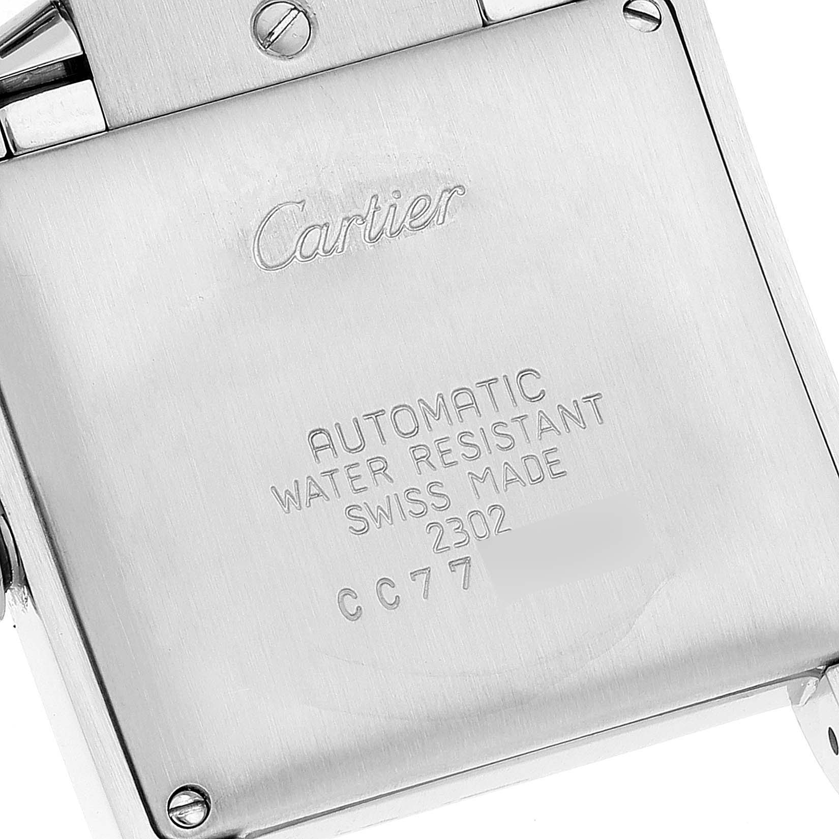 This image shows the back case of a Cartier Tank Francaise W51002Q3 Men's Stainless Steel Silver Dial W51002Q3 Men's Stainless Steel Silver Dial watch, displaying inscriptions about its specifications.