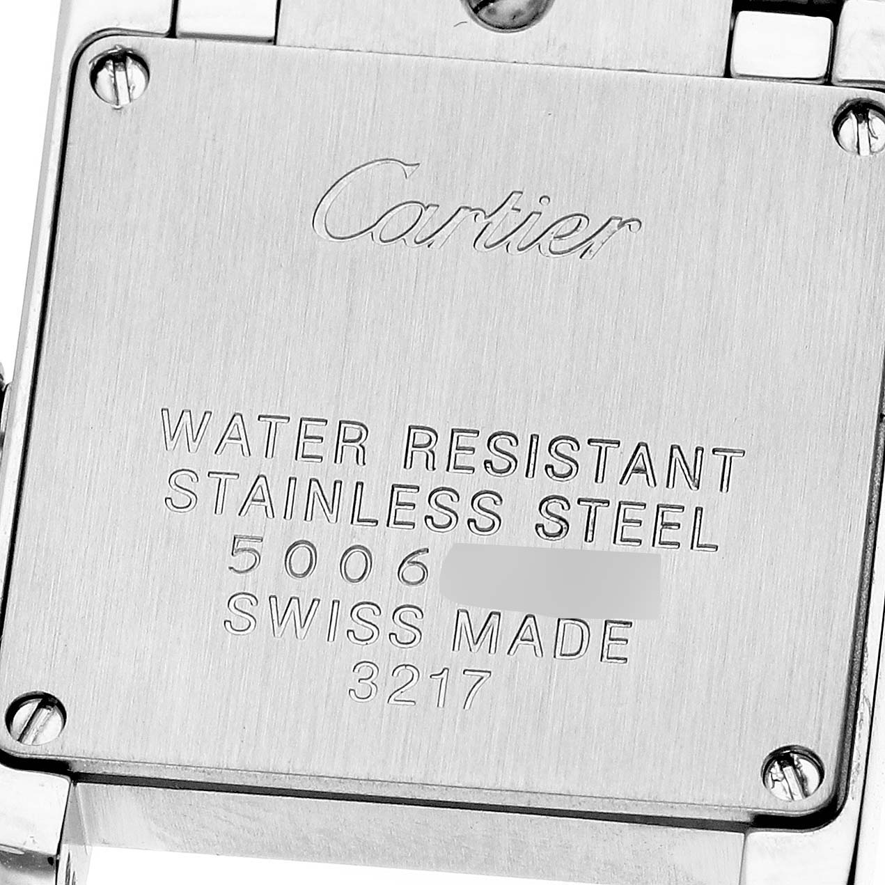 The image shows the back case of a Cartier Tank Française watch, displaying the brand, model, and material details.