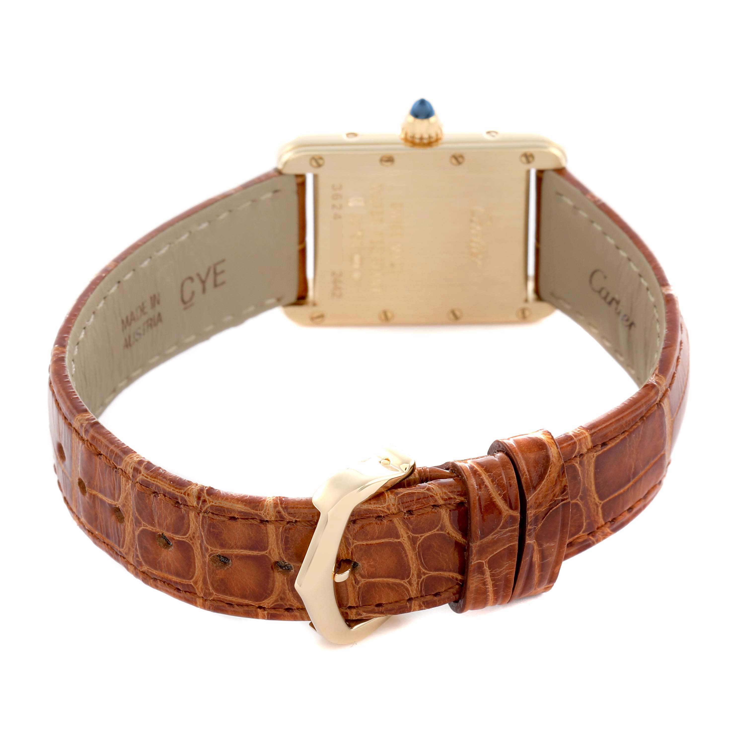 The image shows the back view of the Cartier Tank Louis W1529856 Women
s Yellow Gold Silver Dial watch, highlighting the case back, crown, and brown leather strap.