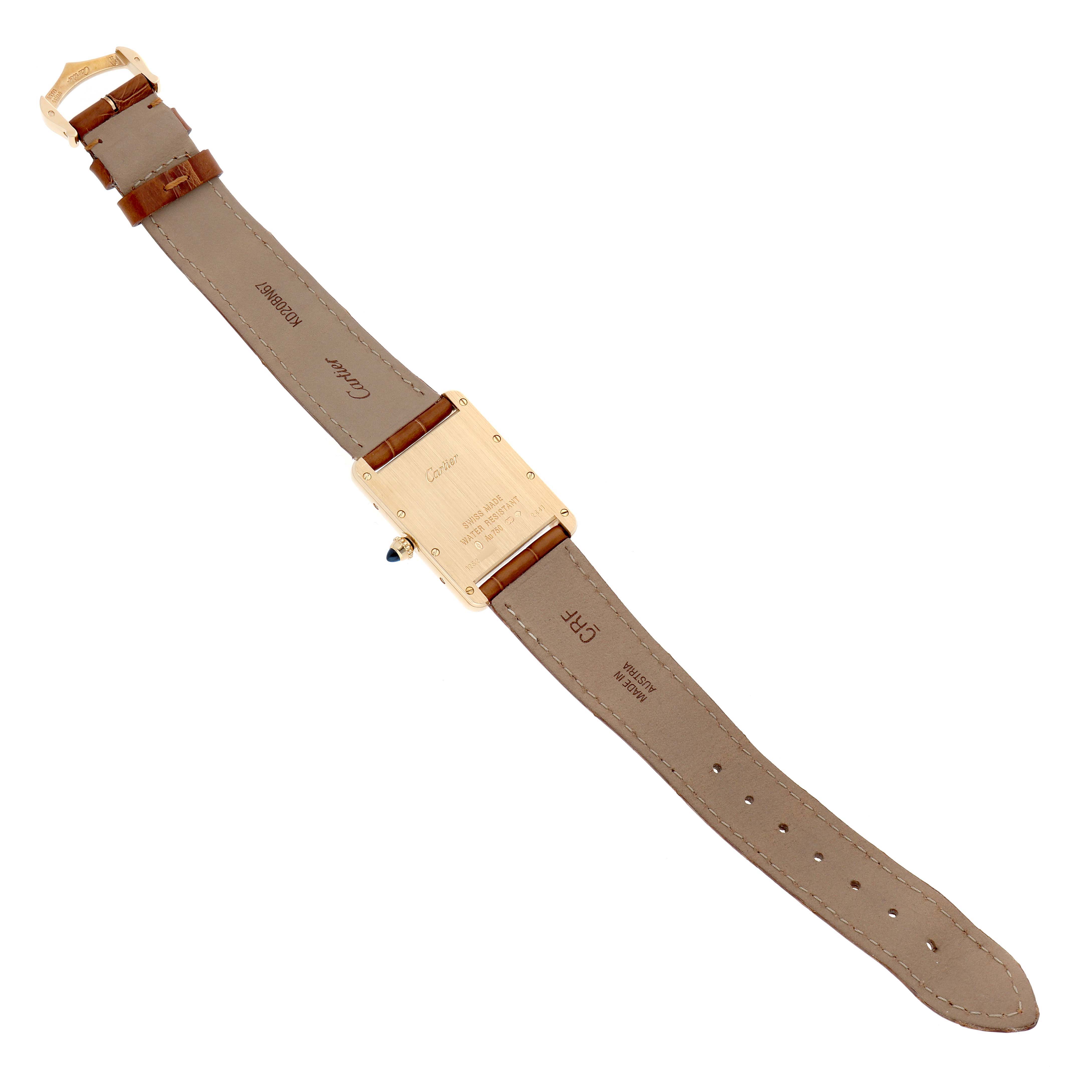 The Cartier Tank Louis W1529756 Men
s Yellow Gold Silver Dial watch is shown from the back, displaying the case back, buckle, and beige leather strap.