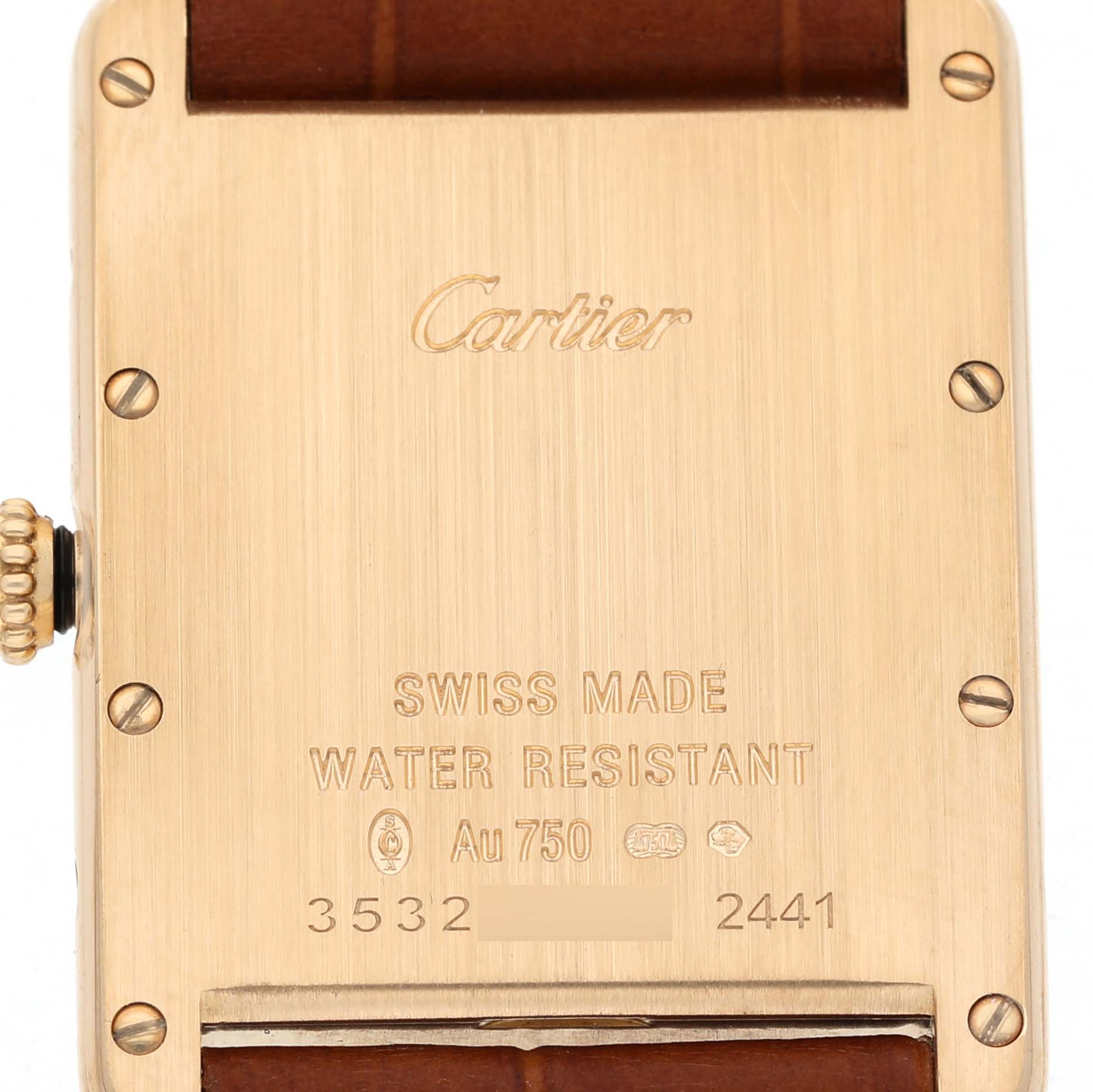 The image shows the back case of the Cartier Tank Louis W1529756 Men's Yellow Gold Silver Dial watch, featuring markings and engraving details.