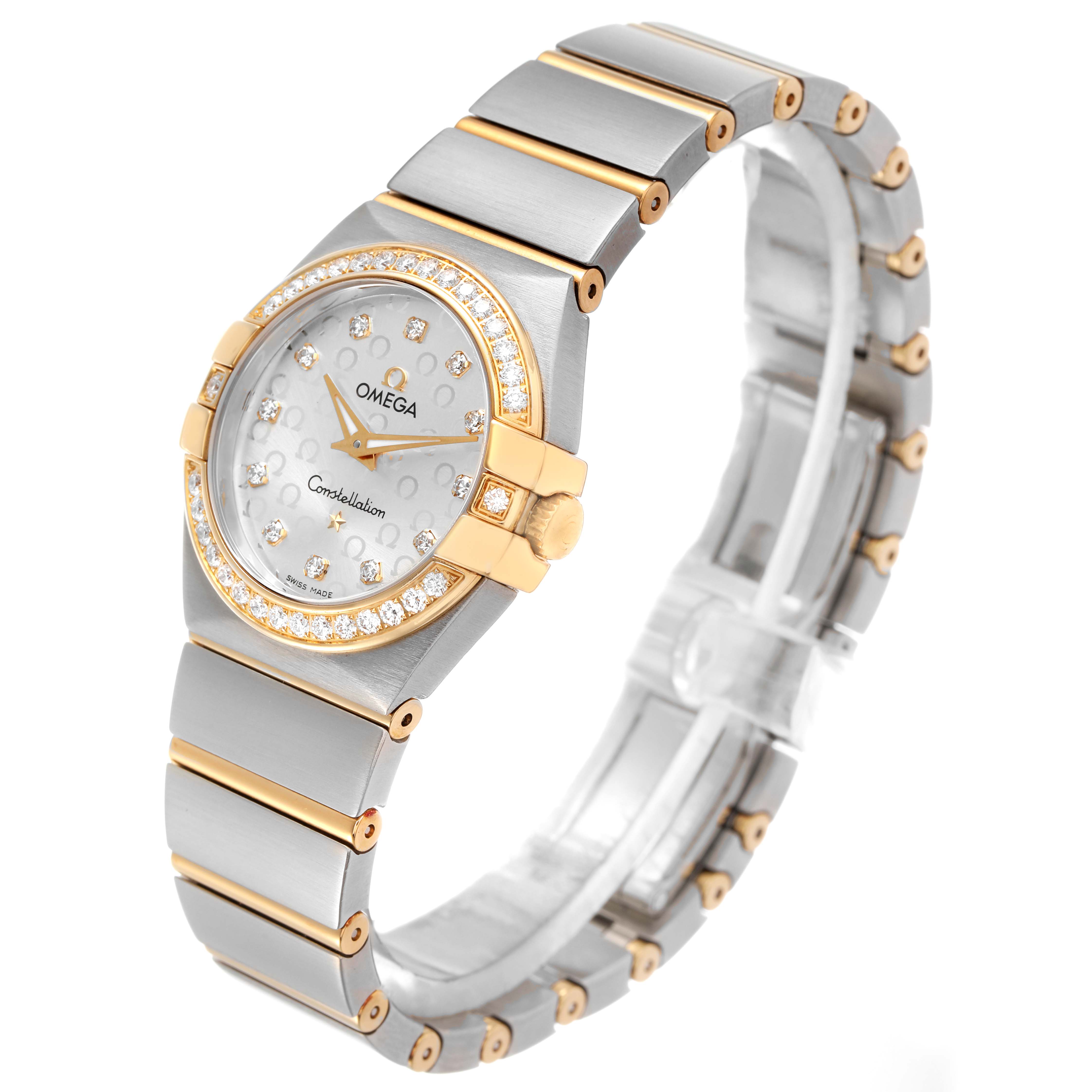 The Omega 123.25.27.60.52.002 Women's Steel and Gold (two tone) Silver Dial Constellation Steel Yellow Gold Diamond Watch is shown at a three-quarter angle, highlighting its face, bezel, and bracelet.