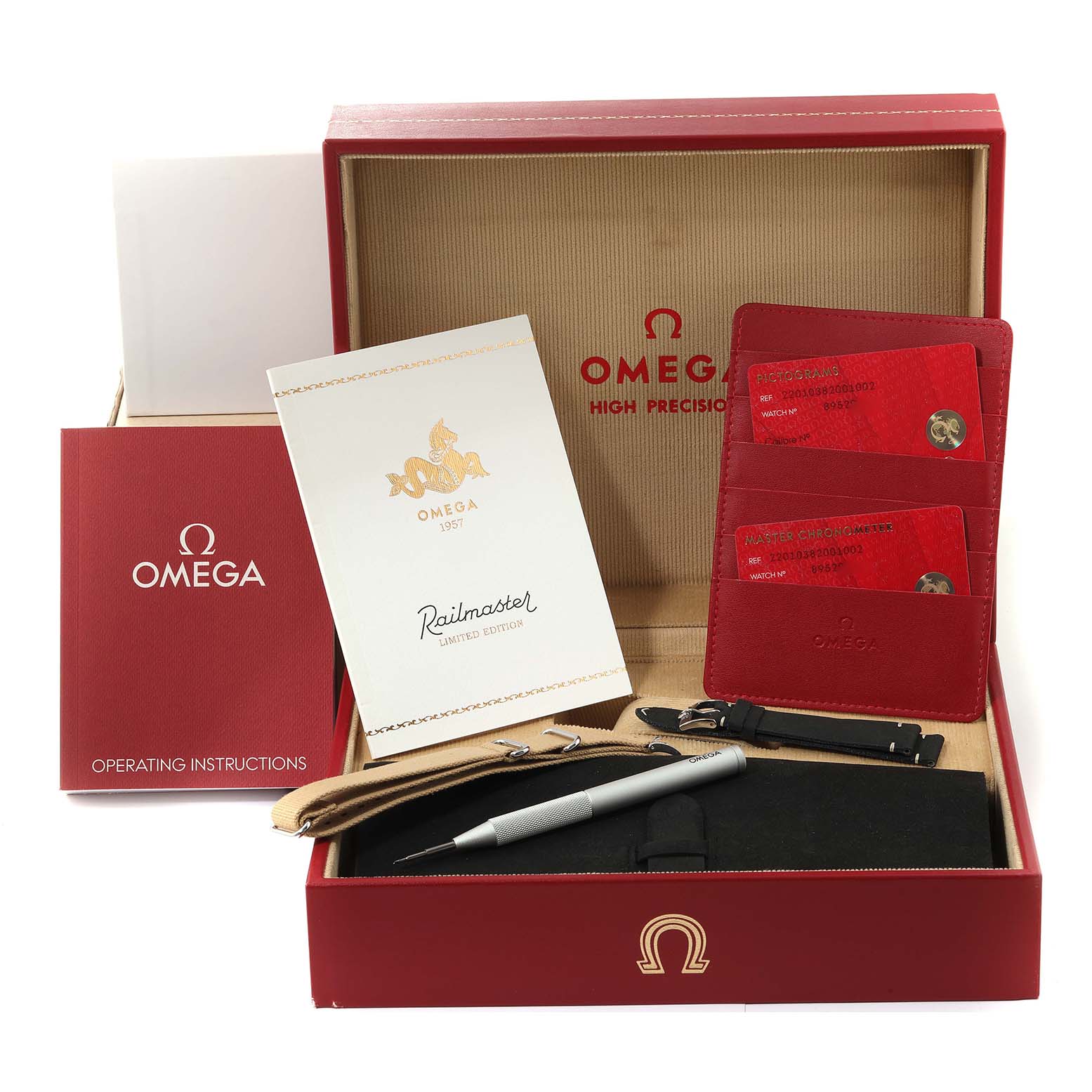 The image shows the packaging and accessories for an Omega Seamaster 220.10.38.20.01.002 Men's Stainless Steel Black Dial 220.10.38.20.01.002 Men's Stainless Steel Black Dial model, including a box, manuals, warranty cards, straps, and a tool.