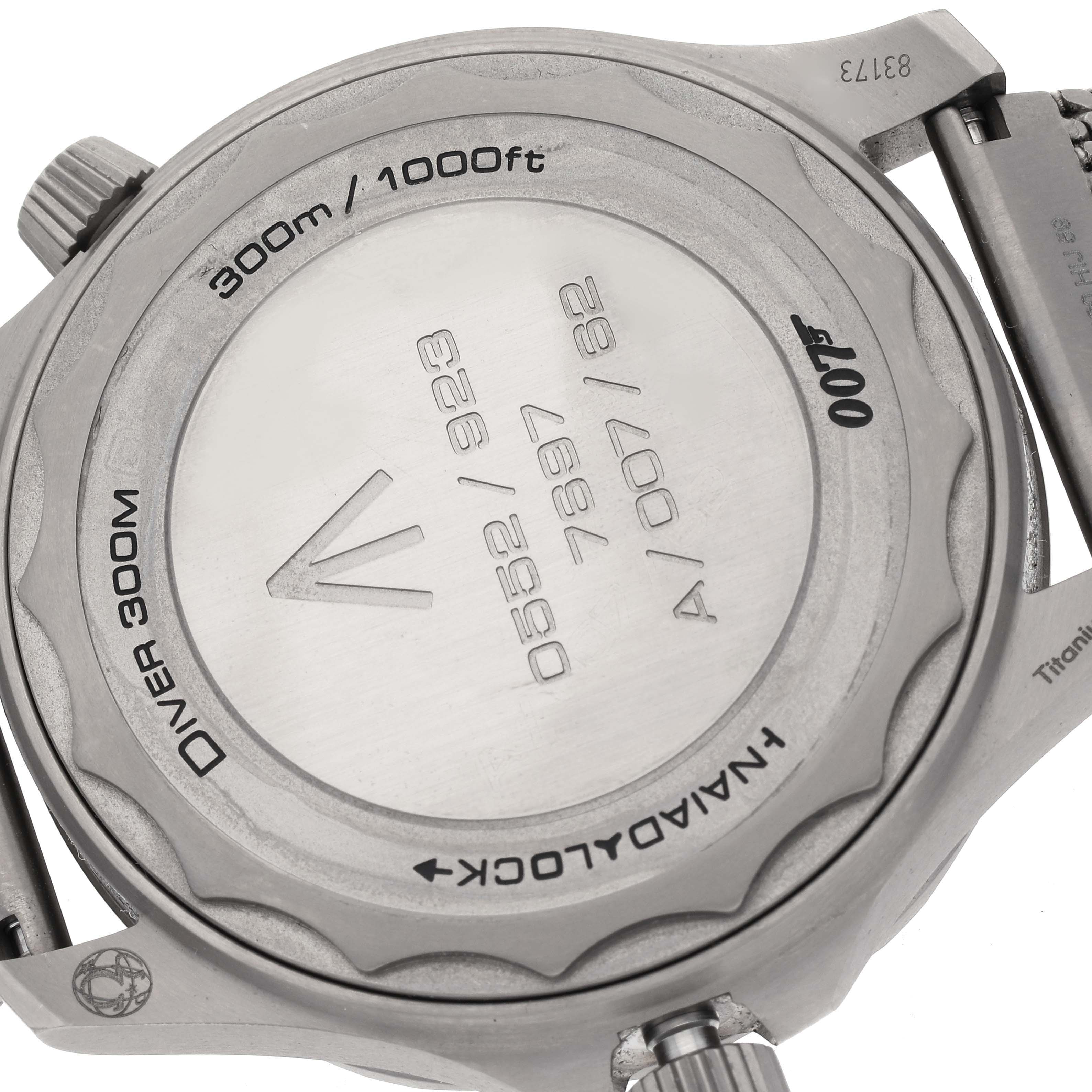 The image shows the back case of an Omega Seamaster 210.92.42.20.01.001 Men's Titanium Brown Dial 210.92.42.20.01.001 Men's Titanium Brown Dial Diver 300m watch, displaying its engravings and water resistance.