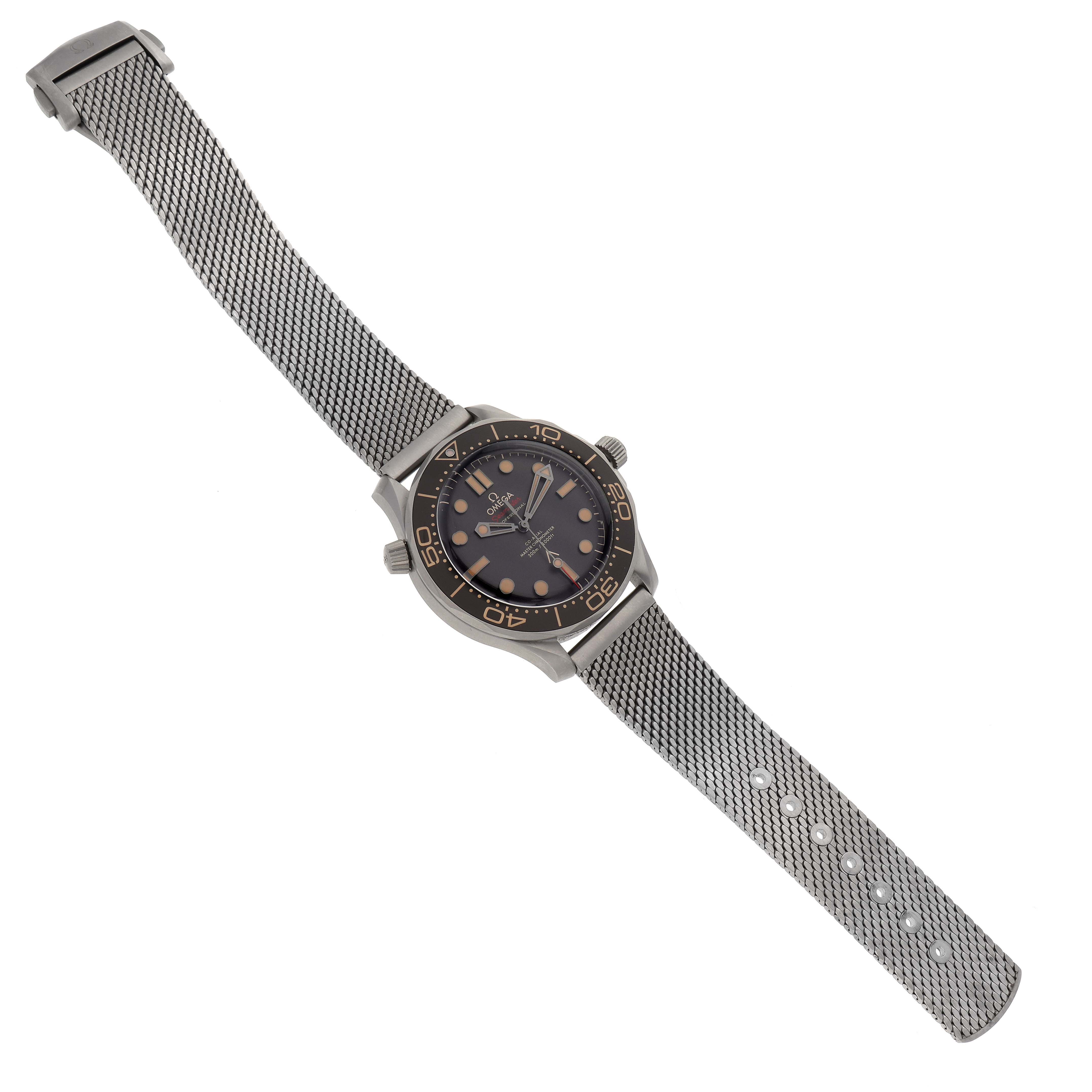 The image shows an angled top view of an Omega Seamaster 210.92.42.20.01.001 Men's Titanium Brown Dial 210.92.42.20.01.001 Men's Titanium Brown Dial watch, including the dial, bezel, crown, and metal mesh strap.