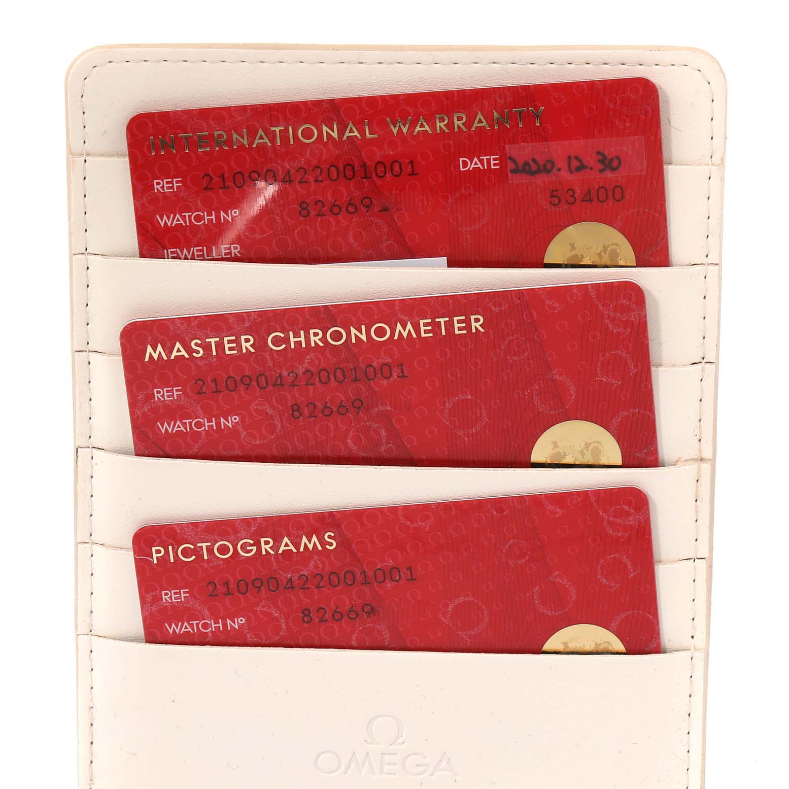 The image shows Omega Seamaster 210.90.42.20.01.001 Men's Titanium Brown Dial 210.90.42.20.01.001 Men's Titanium Brown Dial watch warranty cards in a white cardholder.