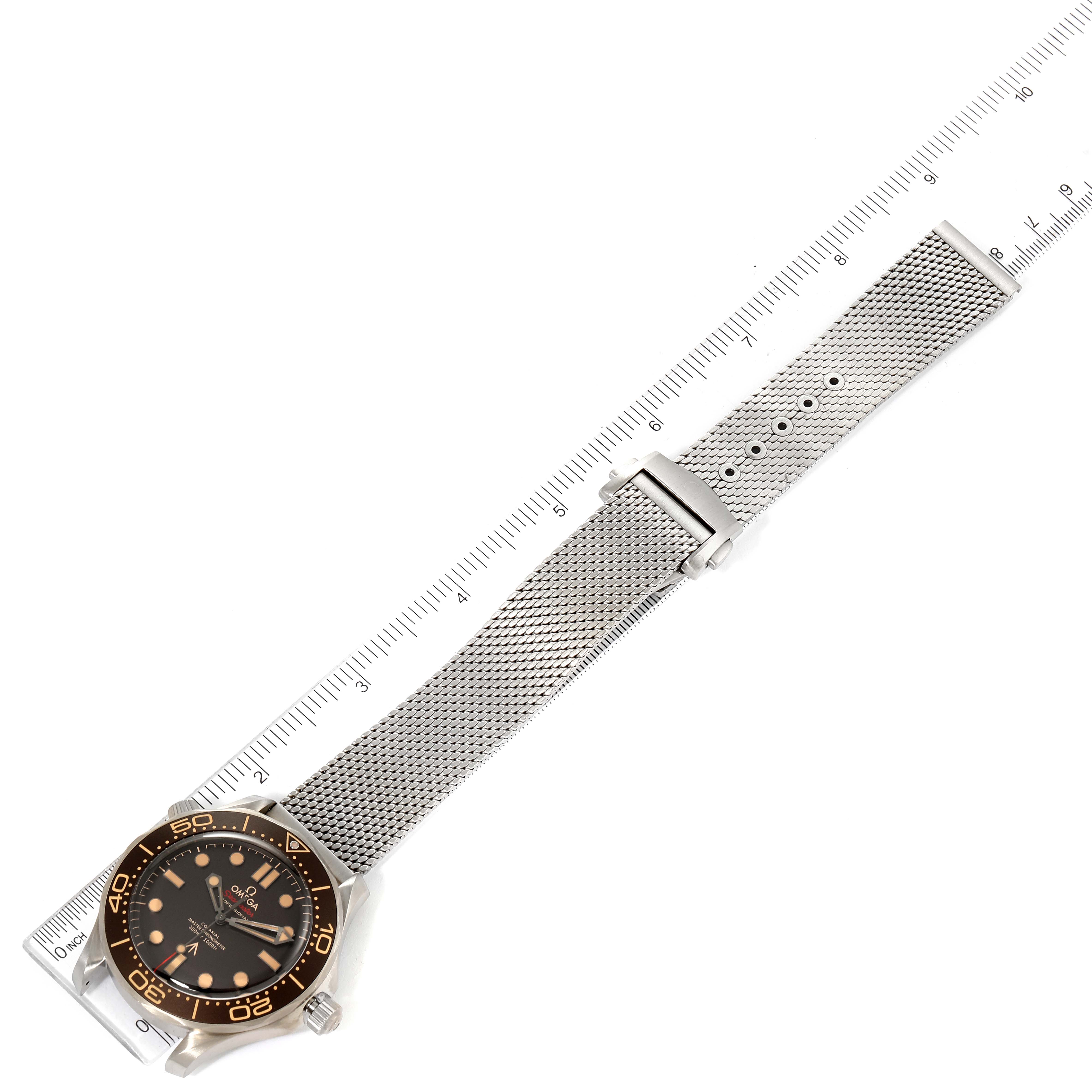 The image shows an overhead view of an Omega Seamaster 210.90.42.20.01.001 Men's Titanium Brown Dial 210.90.42.20.01.001 Men's Titanium Brown Dial watch, highlighting the face, bezel, and metal mesh strap.