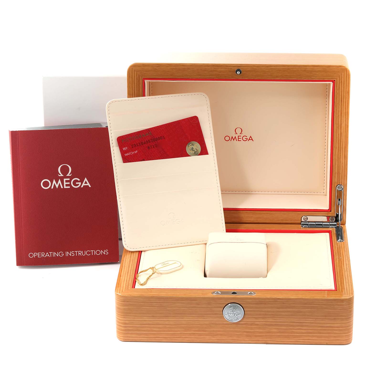 This image shows the accessories for an Omega Aqua Terra 231.10.43.52.03.001 Men
s Stainless Steel Blue Dial 231.10.43.52.03.001 Men
s Stainless Steel Blue Dial watch, including the watch box, warranty cardholder, and operating instructions.