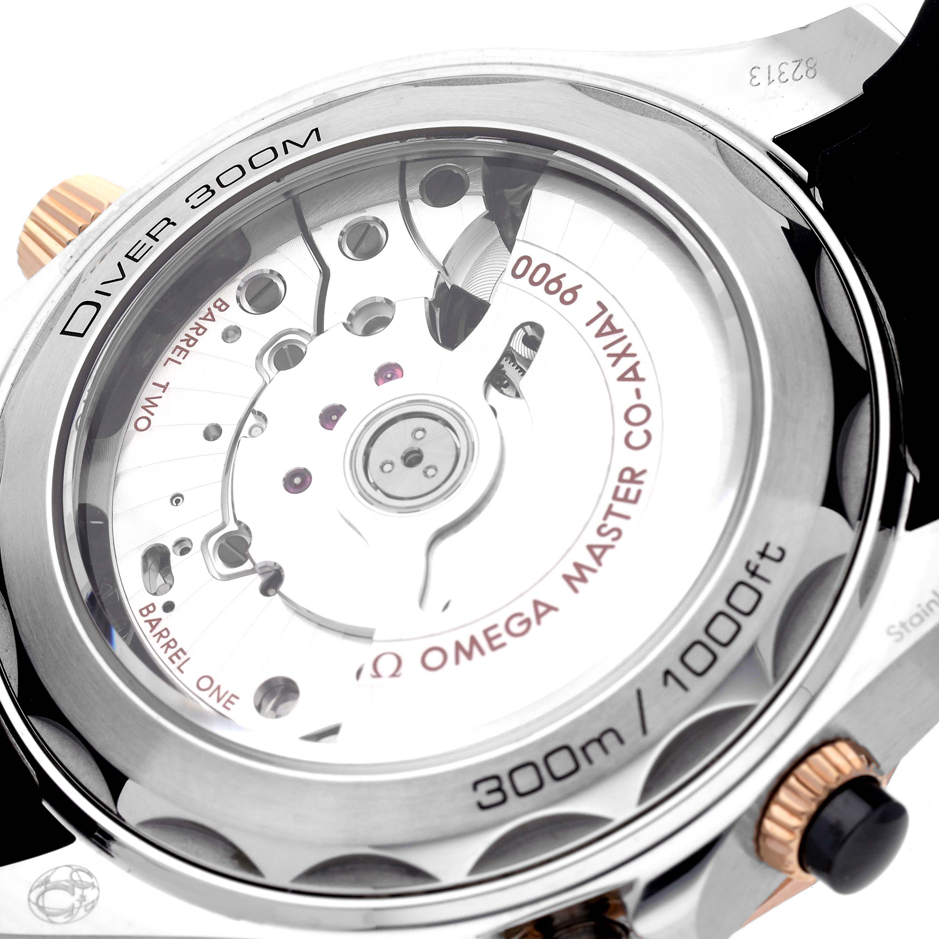 The image shows the back view of an Omega Seamaster 210.22.44.51.01.001 Men's Steel and Gold (two tone) Black Dial 210.22.44.51.01.001 Men's Steel and Gold (two tone) Black Dial Diver 300M watch, focusing on the exposed movement and case back details.