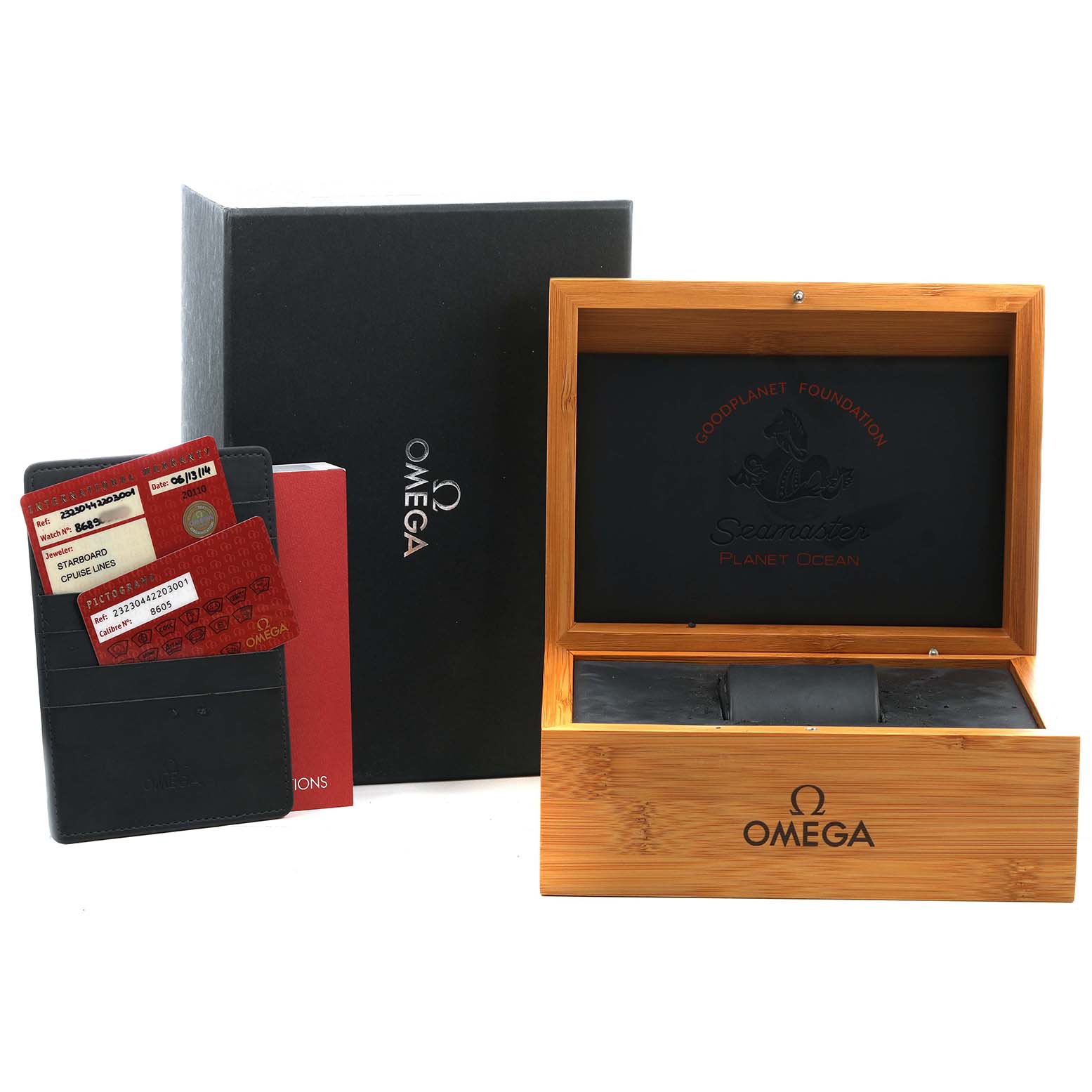The image shows the packaging and accessories for the Omega Planet Ocean 232.30.44.22.03.001 Men's Stainless Steel Blue Dial watch, including a wooden box, cards, and a paper box.
