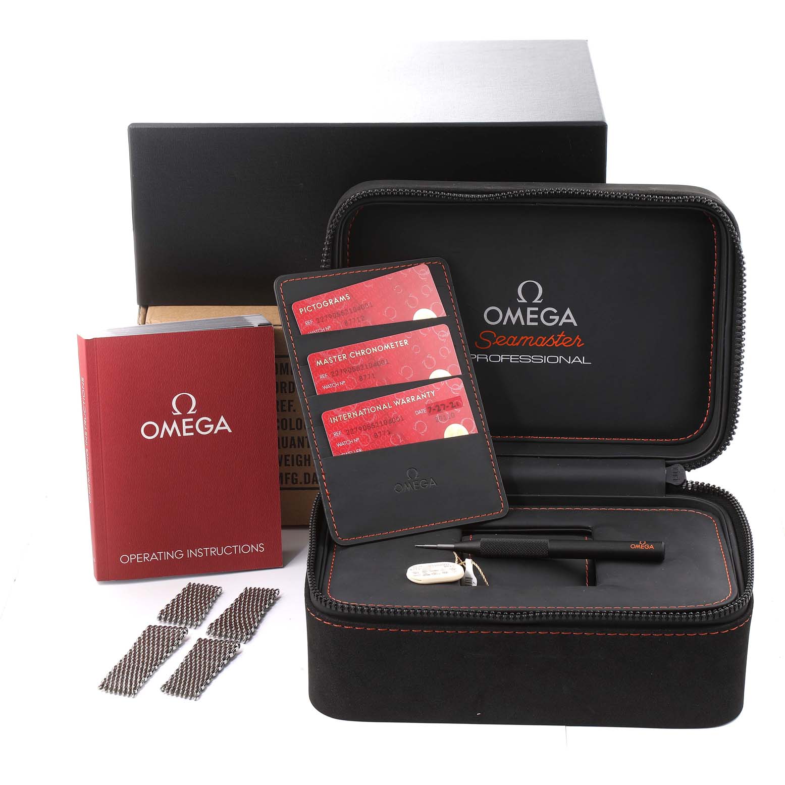 The image shows Omega Seamaster Professional Ploprof model accessories, including a case, manuals, bracelets, warranty cards, and tools.