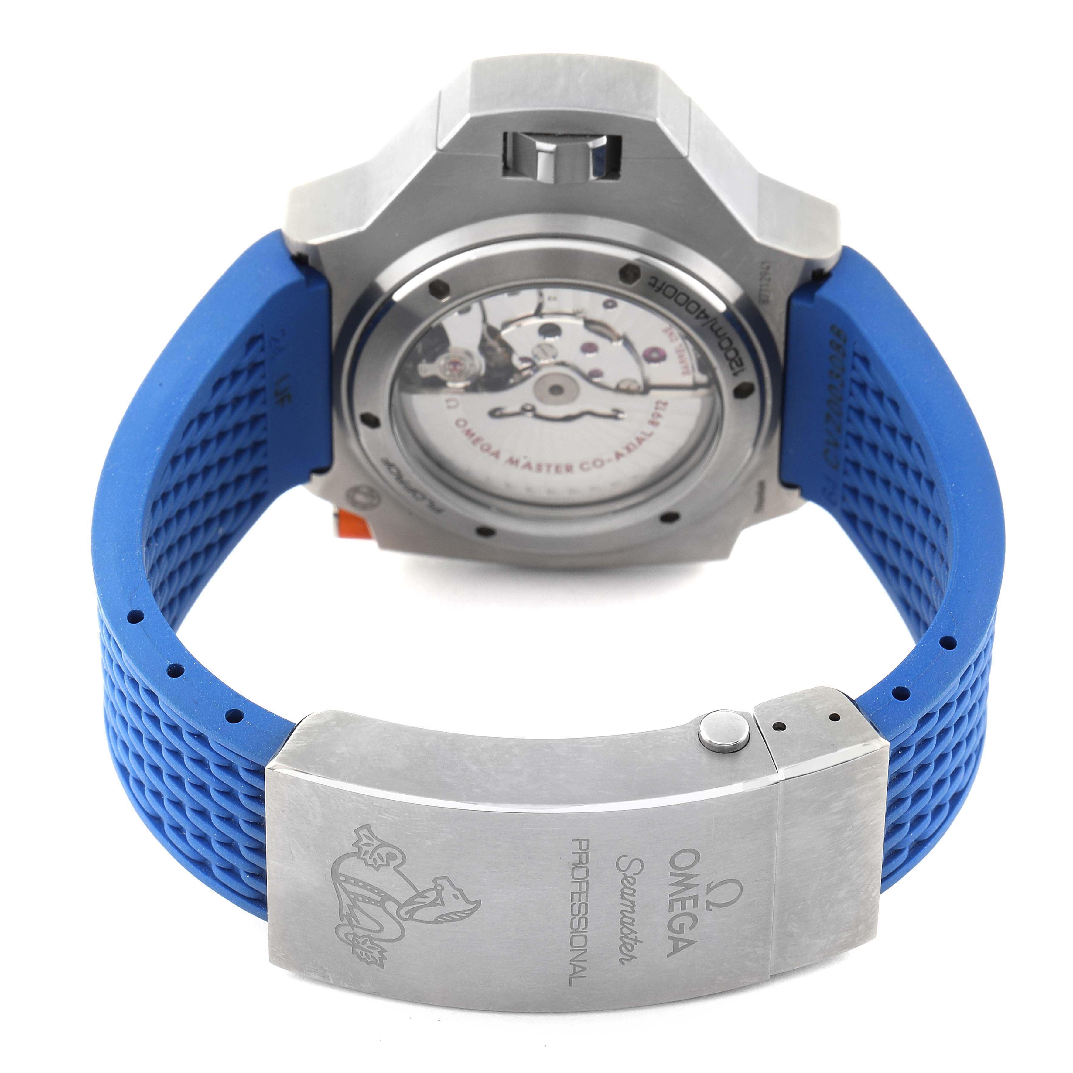 The image shows the back side of the Omega Ploprof 227.90.55.21.04.001 Men
s Titanium White Dial 227.90.55.21.04.001 Men
s Titanium White Dial watch, highlighting the open case back and part of the blue strap.