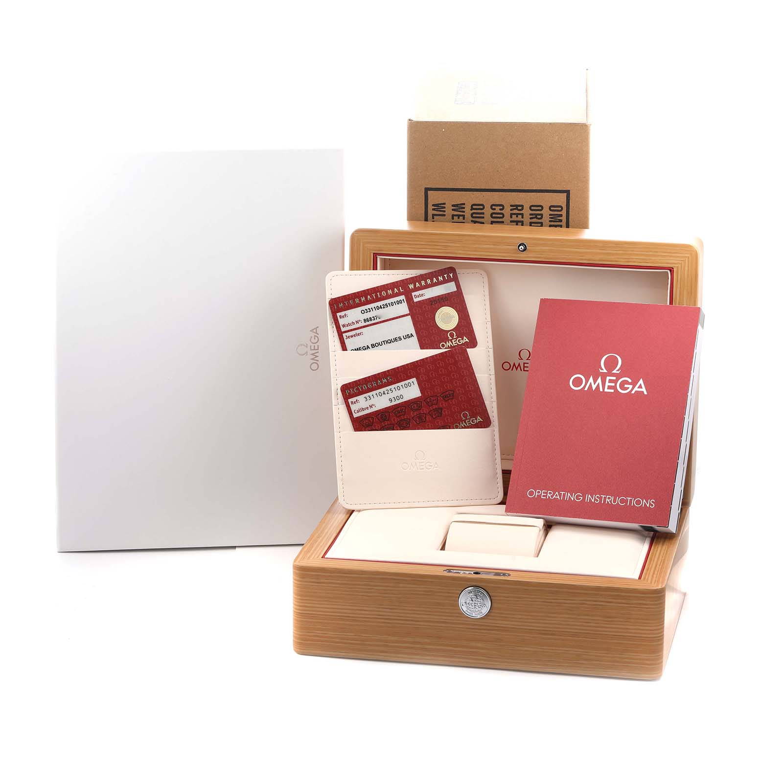 The image shows the packaging and accessories for an Omega Speedmaster 331.10.42.51.01.001 Men
s Stainless Steel Black Dial, including a wooden box, warranty cards, and instructions.