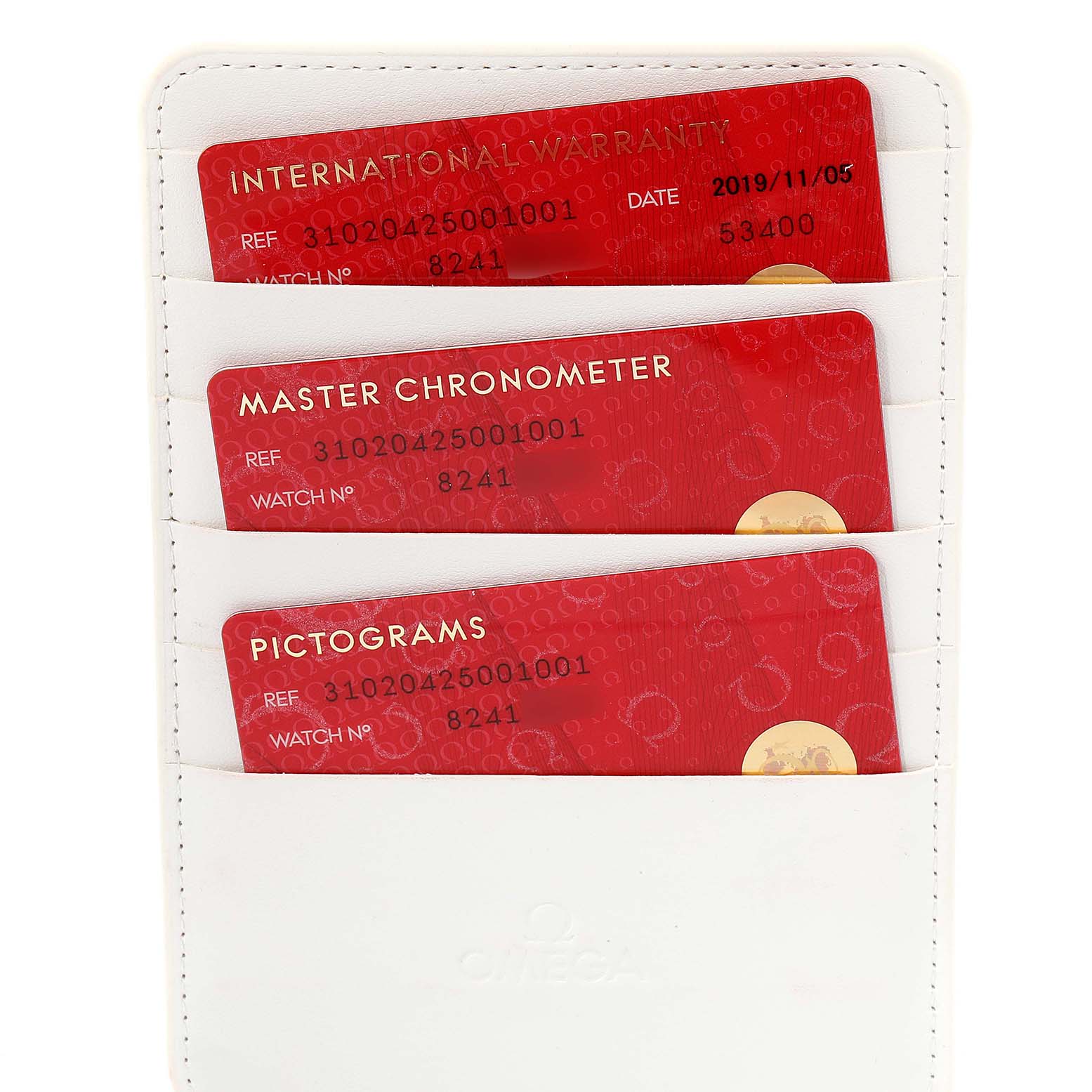 The image shows the warranty and certification cards for an Omega Speedmaster 310.20.42.50.01.001 Men's Stainless Steel Grey Dial 310.20.42.50.01.001 Men's Stainless Steel Grey Dial watch, placed in a white cardholder.