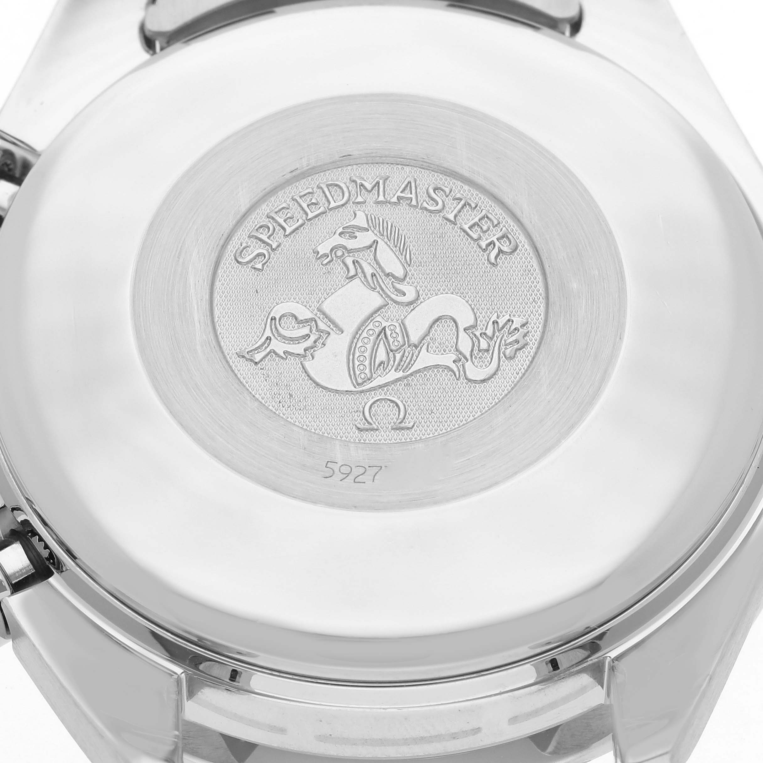 The image shows the back case of an Omega Speedmaster 3523.80.00 Men
s Stainless Steel Blue Dial 3523.80.00 Men
s Stainless Steel Blue Dial watch, displaying the engraved emblem and model number.