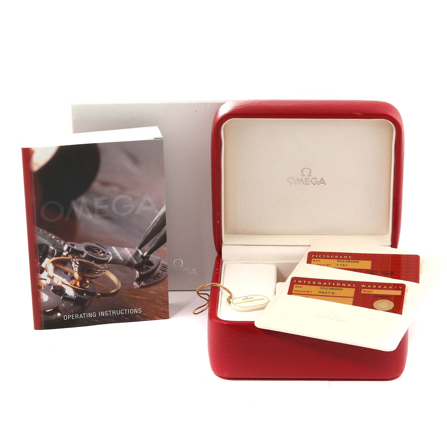 The image shows an Omega Speedmaster 3523.80.00 Men
s Stainless Steel Blue Dial 3523.80.00 Men
s Stainless Steel Blue Dial watch box, warranty cards, operating instructions, and a tag.