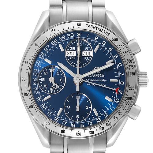 The image shows a front view of an Omega Speedmaster watch, highlighting the blue dial, subdials, and tachymeter scale.