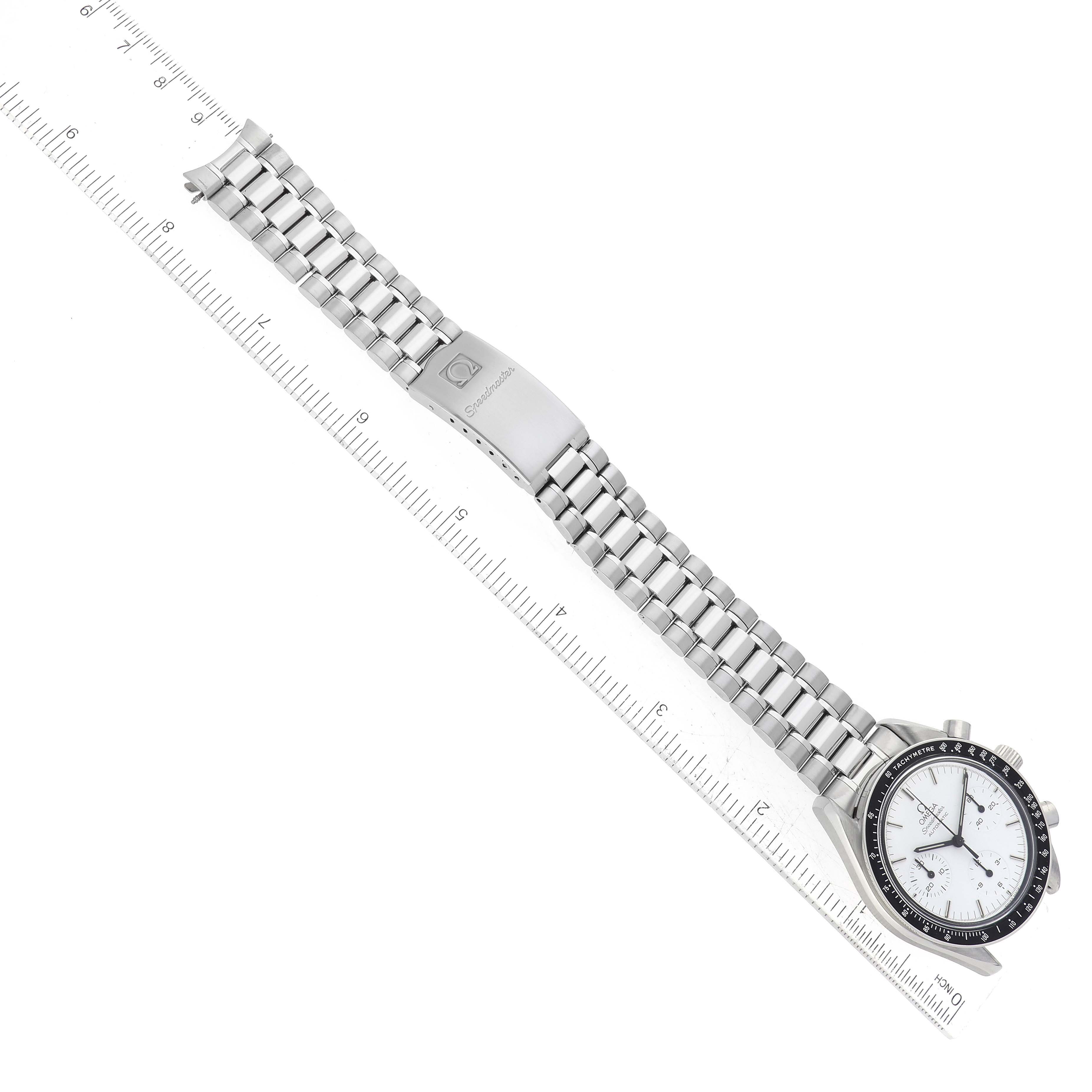 The image shows an Omega Speedmaster 3510.20.00 Men's Stainless Steel White Dial 3510.20.00 Men's Stainless Steel White Dial watch laid flat with a metal bracelet and clasp, next to a ruler for scale.