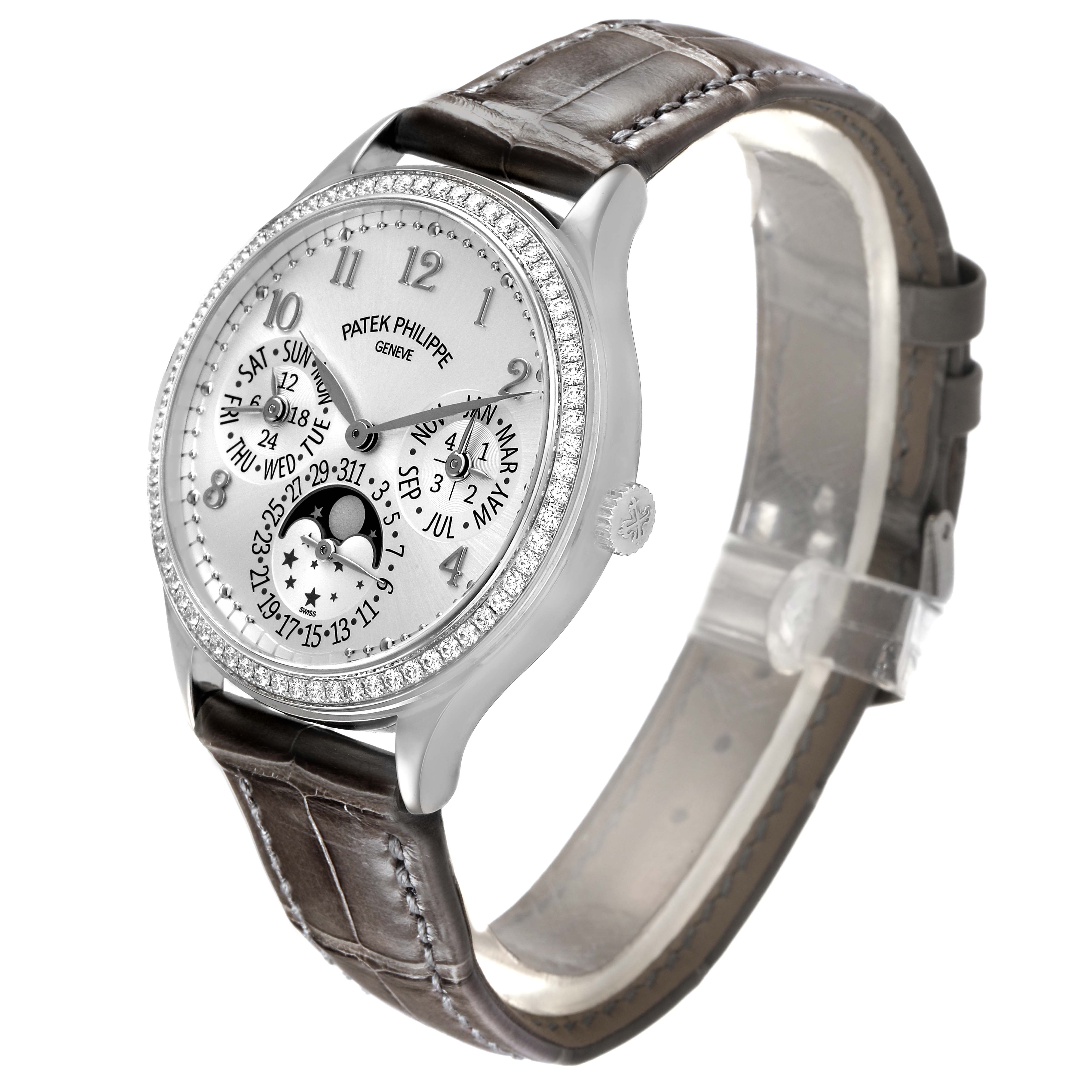 The Patek Philippe Complications 7140G-001 Women's White Gold Silver Dial watch is shown at a three-quarter angle, highlighting the face, bezel, and strap.