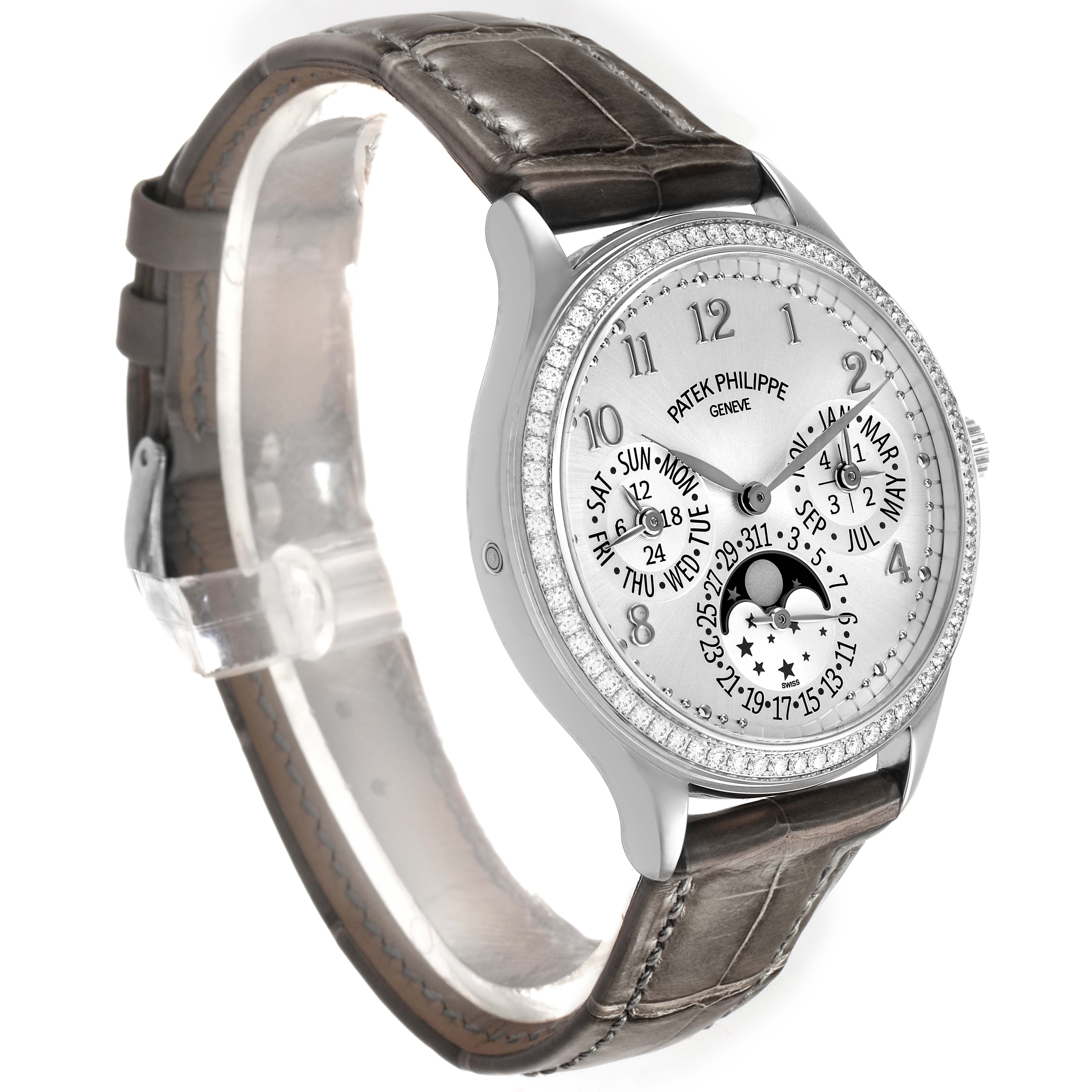 The Patek Philippe Complications 7140G-001 Women's White Gold Silver Dial watch is shown at a three-quarter angle, highlighting its face, bezel, and leather strap.