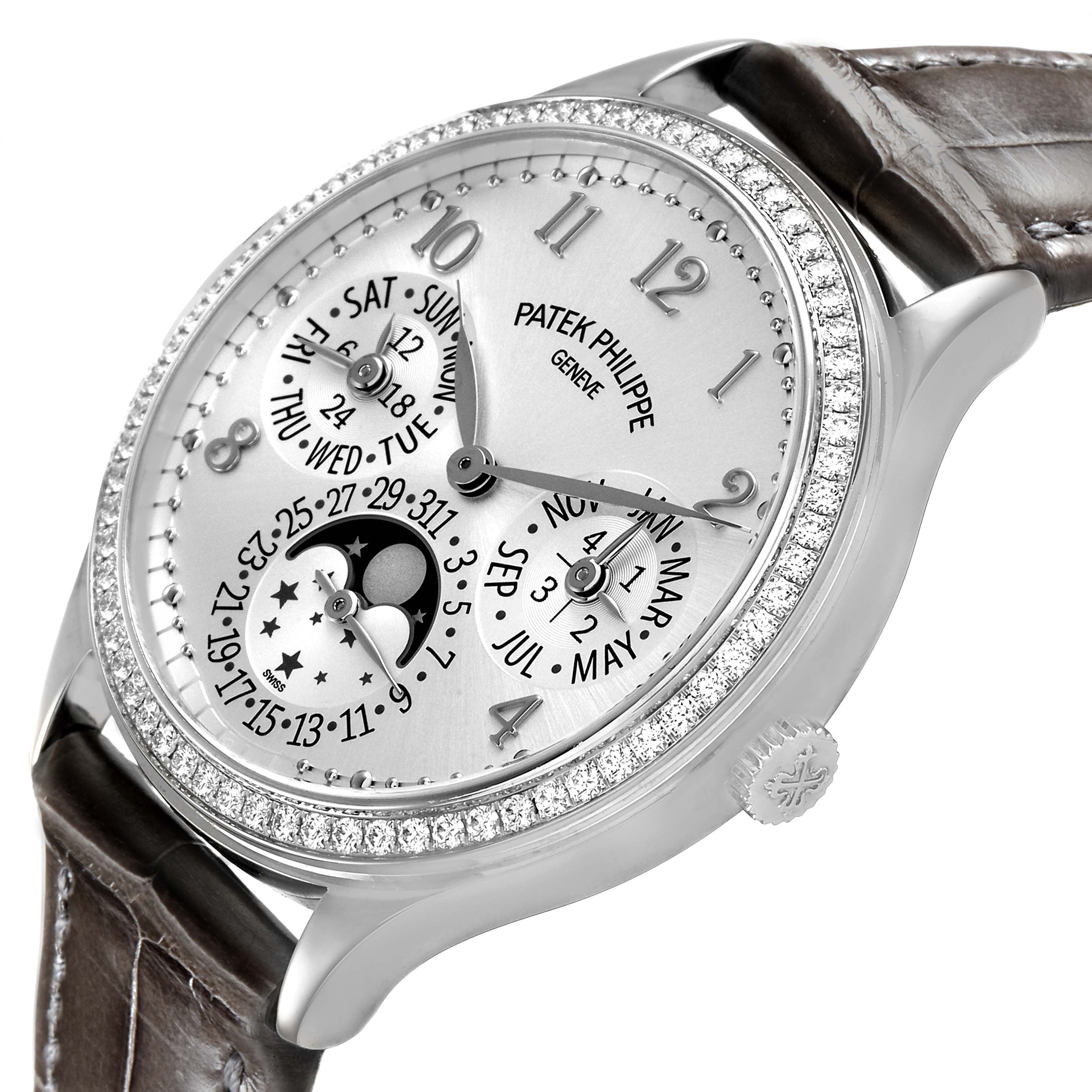 The Patek Philippe Complications 7140G-001 Women's White Gold Silver Dial watch is shown at a three-quarter angle, displaying the dial, moon phase, and part of the strap.