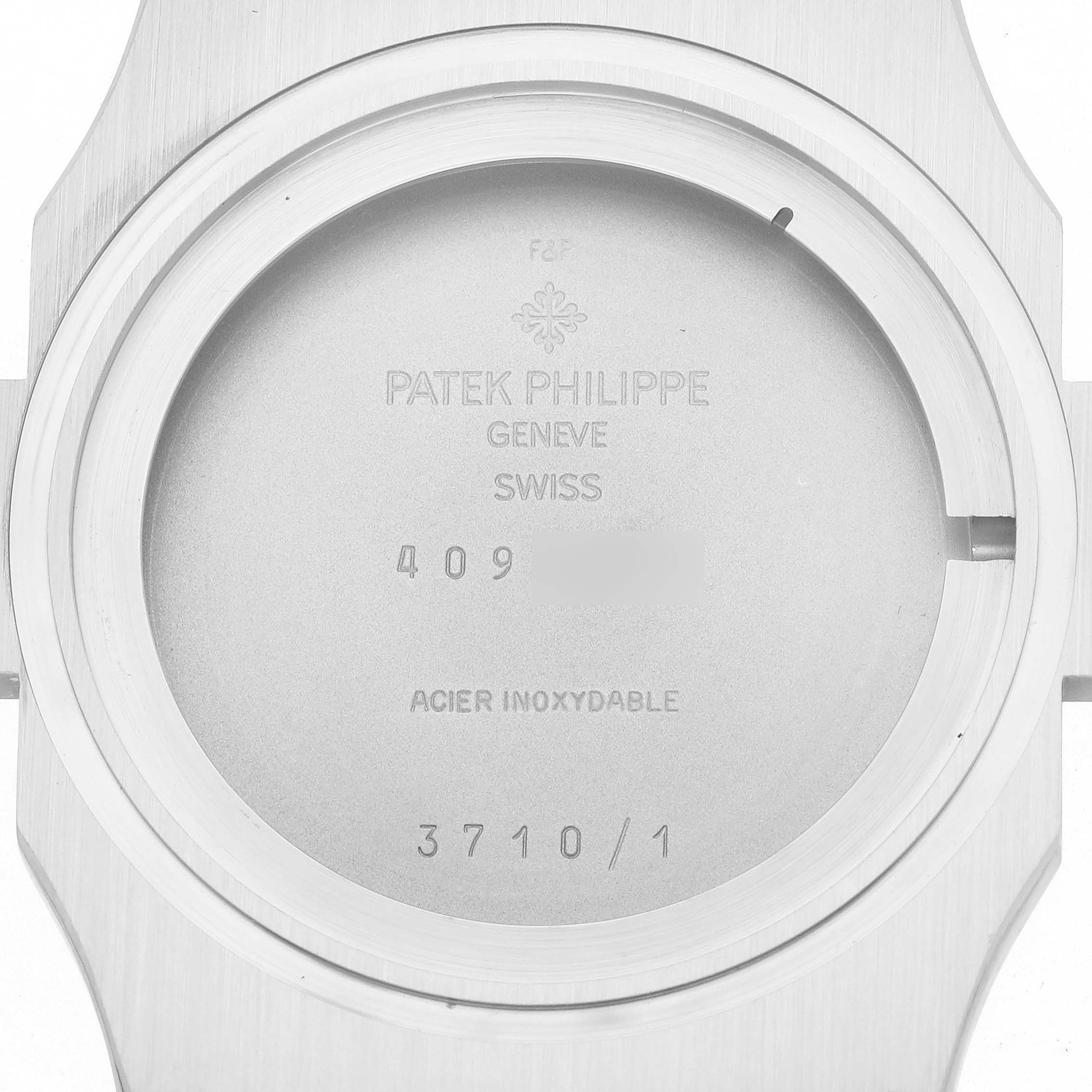 This image shows the case back of a Patek Philippe Nautilus 3710/1A-001 Men's Stainless Steel Black Dial 3710/1A-001 Men's Stainless Steel Black Dial model watch with engravings and markings including the model number 3710/1.